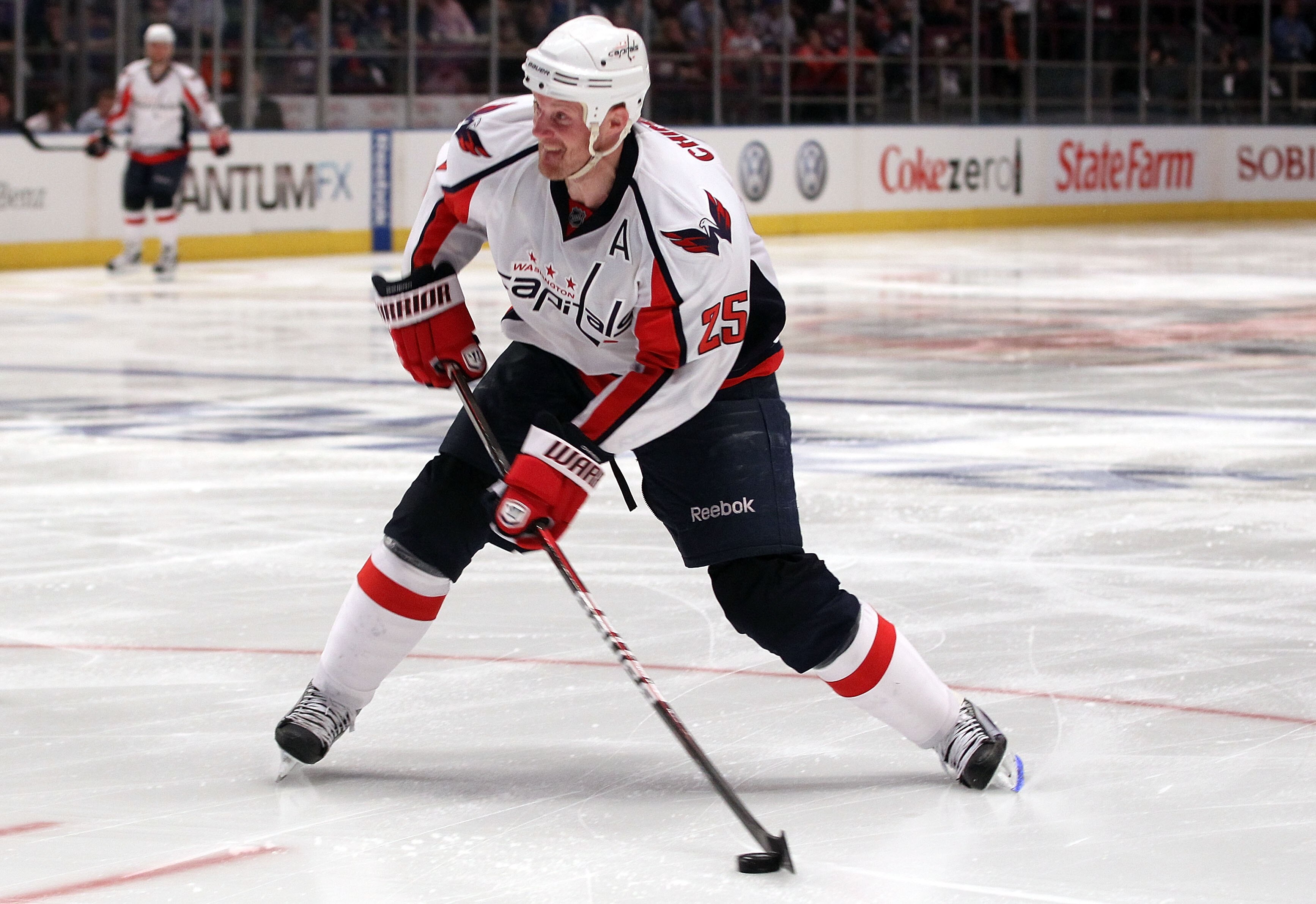 NEW YORK, NY - APRIL 20: Jason Chimera #25 of the Washington Capitals controls the puck against the New York Rangers in Game Four of the Eastern Conference Quarterfinals during the 2011 NHL Stanley Cup Playoffs at Madison Square Garden on April 20, 2011 NEW YORK, NY - APRIL 20: Jason Chimera #25 of the Washington Capitals controls the puck against the New York Rangers in Game Four of the Eastern Conference Quarterfinals during the 2011 NHL Stanley Cup Playoffs at Madison Square Garden on April 20, 2011