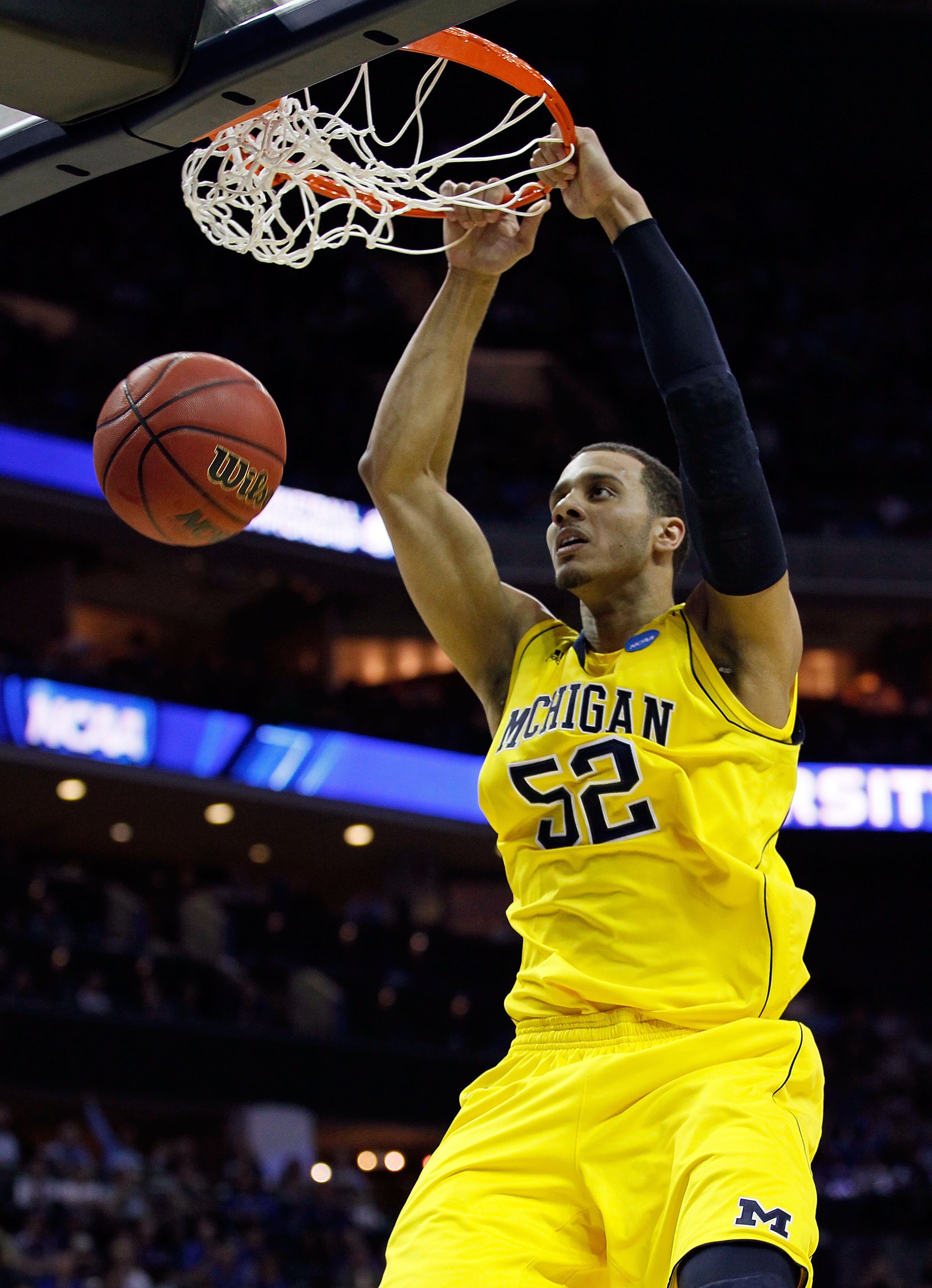 CHARLOTTE, NC - MARCH 20:  Jordan Morgan #52 of the Michigan Wolverines dunks the ball while taking on the Duke Blue Devils during the third round of the 2011 NCAA men's basketball tournament at Time Warner Cable Arena on March 20, 2011 in Charlotte, Nort