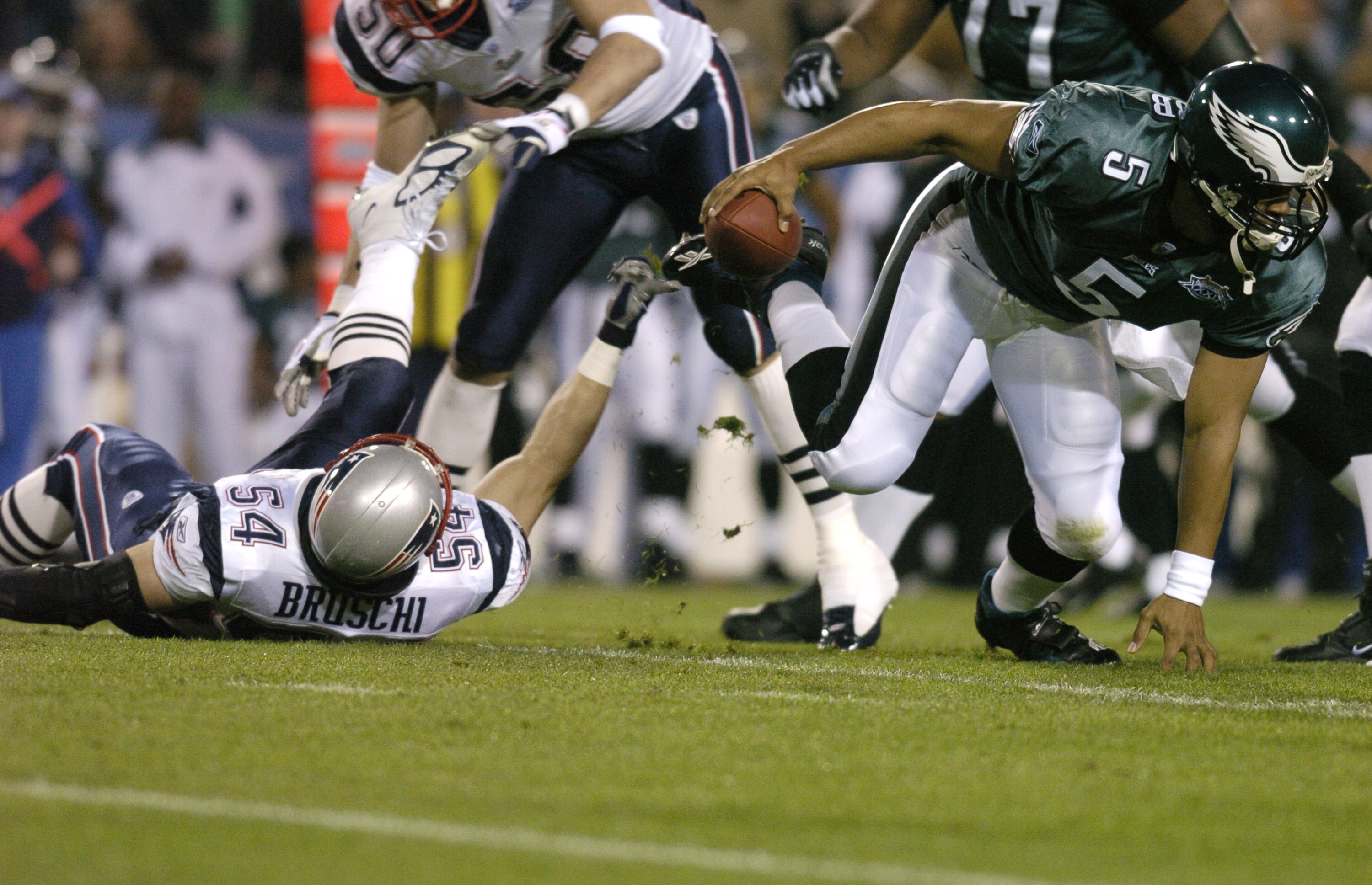 Philadelphia Eagle's QB Donovan McNabb gets past New England Patriot Tedy Bruschi #54 during the first quarter of Super Bowl XXXIX between the Philadelphia Eagles and the New England Patriots  (Photo by Al Messerschmidt/Getty Images)