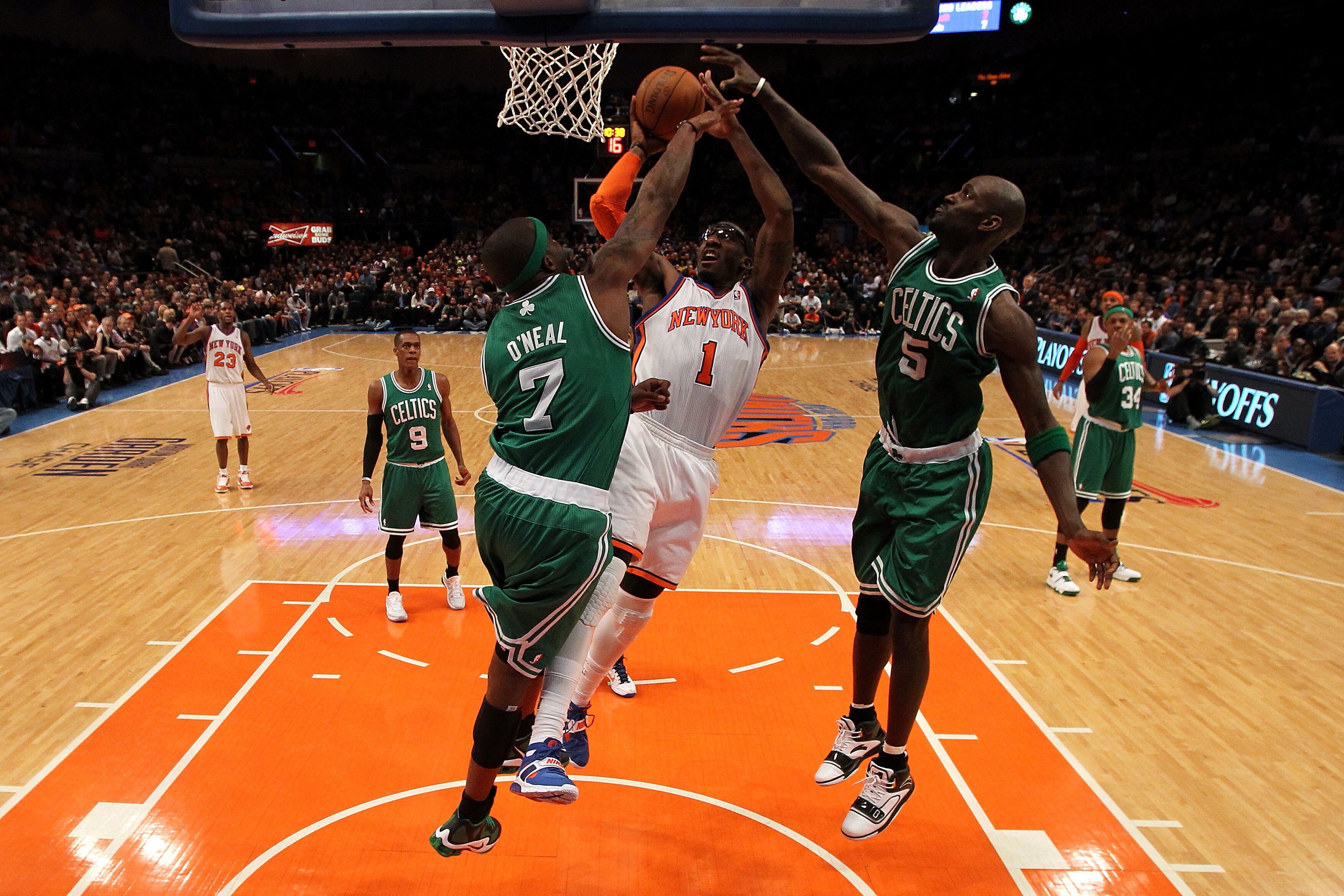 NEW YORK, NY - APRIL 22:  Amar'e Stoudemire #1 of the New York Knicks drives for a shot attempt against Jermaine O'Neal #7 and Kevin Garnett #5 of the Boston Celtics in Game Three of the Eastern Conference Quarterfinals in the 2011 NBA Playoffs on April 2
