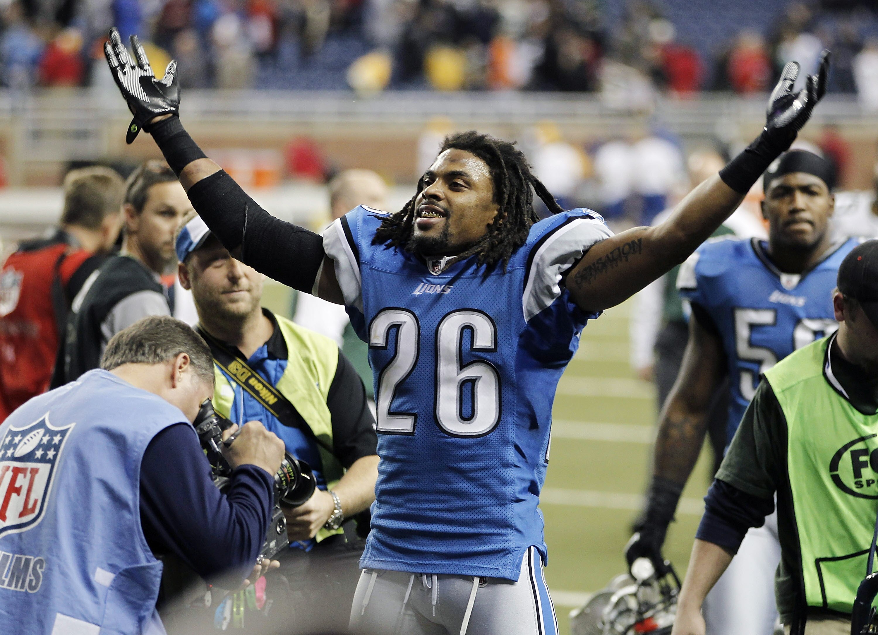 DETROIT, MI - DECEMBER 12:  Louis Delmas #26 of the Detroit Lions leaves the field celebrating a 7-3 victory over the Green Bay Packers on December 12, 2010 at Ford Field in Detroit, Michigan.  (Photo by Gregory Shamus/Getty Images)