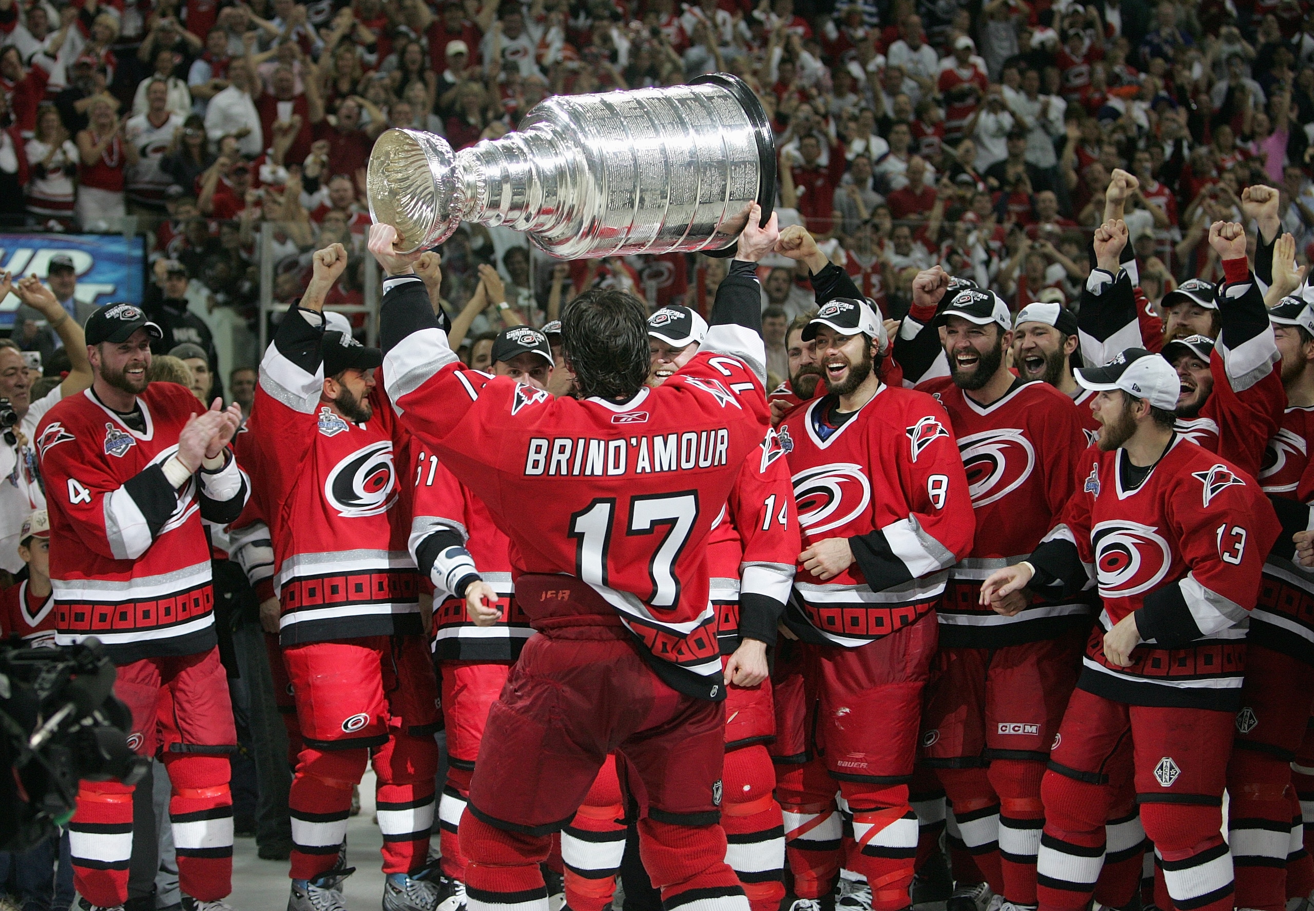 RALEIGH, NC - JUNE 19:  Rod Brind'Amour #17 of the Carolina Hurricanes hoists the Stanley Cup in front of his teammates after the Hurricanes defeated the Edmonton Oilers in game seven of the 2006 NHL Stanley Cup Finals on June 19, 2006 at the RBC Center i