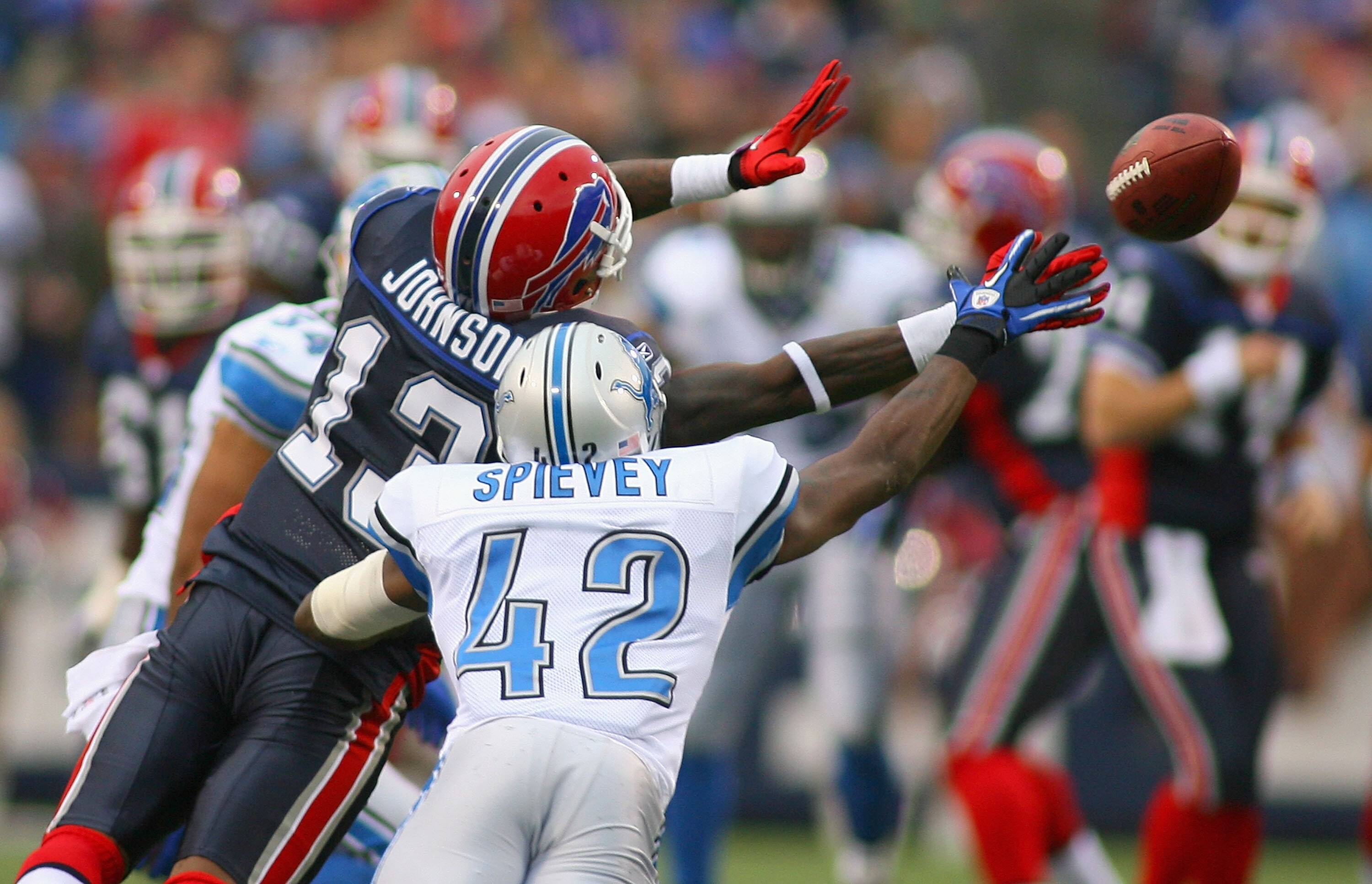 ORCHARD PARK, NY - NOVEMBER 14: Steve Johnson #13 of the Buffalo Bills and Amari Spievey #42 of the Detroit Lions unsuccessfully try to catch a pass at Ralph Wilson Stadium on November 14, 2010 in Orchard Park, New York. Buffalo won 14-12. (Photo by Rick