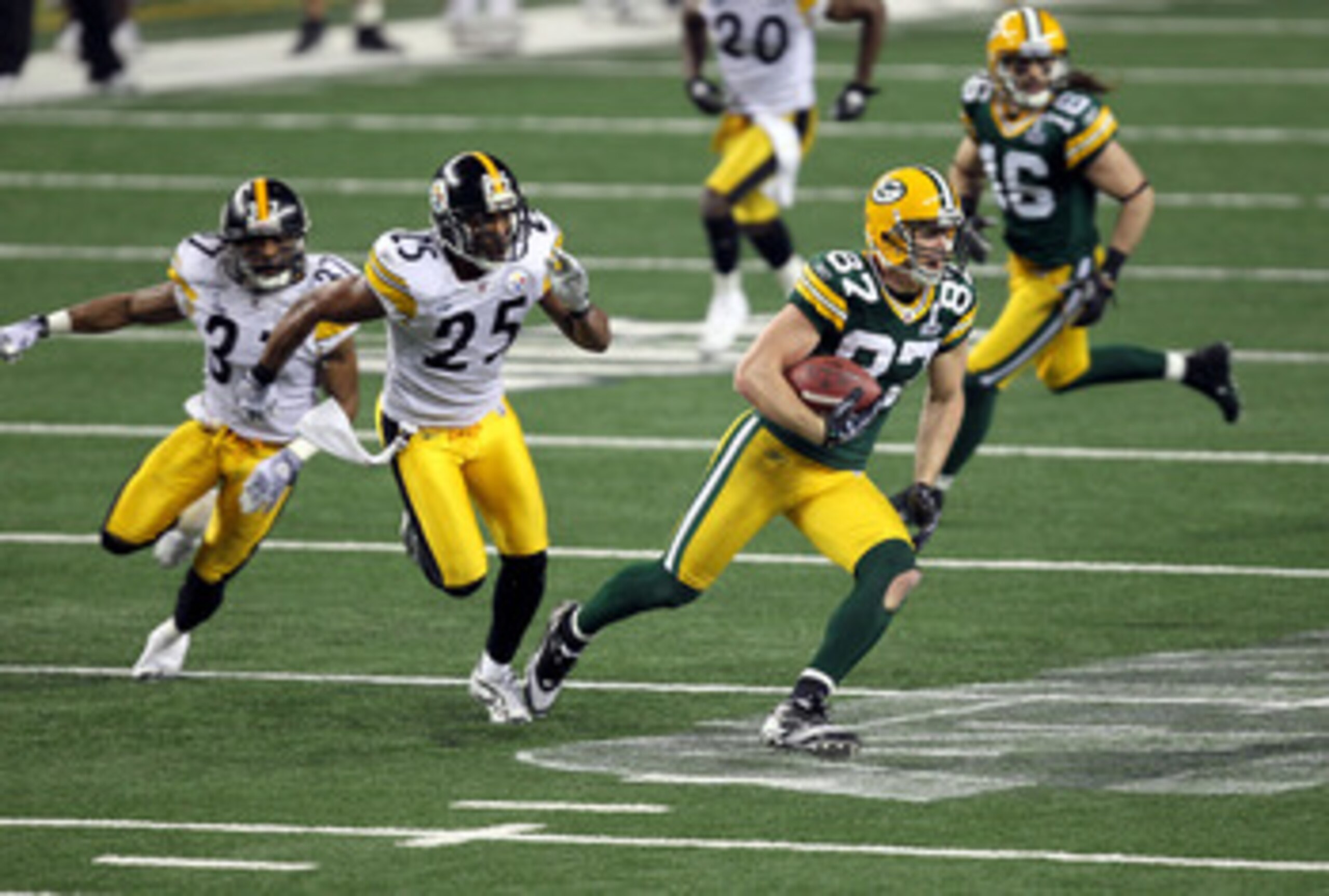 ARLINGTON, TX - FEBRUARY 06:  Jordy Nelson #87 of the Green Bay Packers runs for yards after the catch against Ryan Clark #25 of the Pittsburgh Steelers during Super Bowl XLV at Cowboys Stadium on February 6, 2011 in Arlington, Texas.  (Photo by Mike Ehrm
