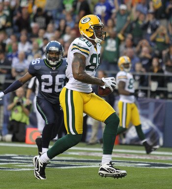 SEATTLE - AUGUST 21:  Tight end Jermichael Finley #88 of the Green Bay Packers scores a touchdown during the preseason game against Josh Wilson #26 of the Seattle Seahawks at Qwest Field on August 21, 2010 in Seattle, Washington. (Photo by Otto Greule Jr/