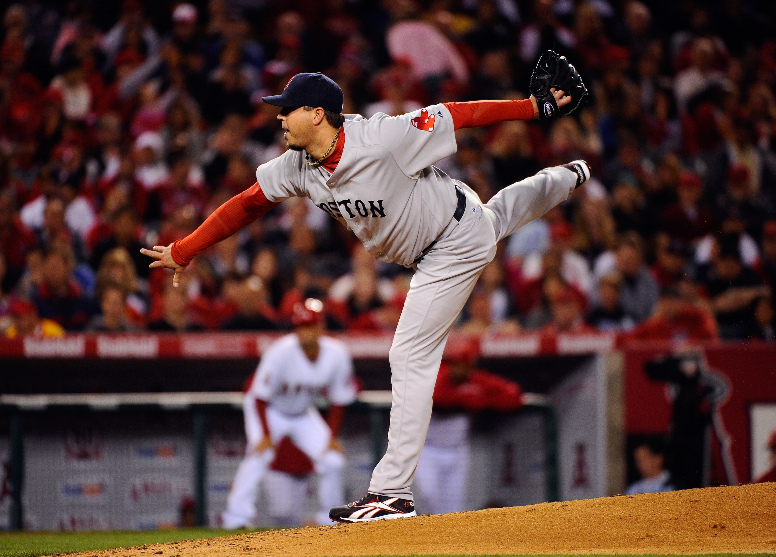 ANAHEIM, CA - APRIL 21:  PitcherJosh Beckett #19 of the Boston Red Sox throws a pitch against Torii Hunter #48 of the Los Angeles Angels of Anaheim during the fourth inning of the baseball game at Angel Stadium of Anaheim on April 21, 2011 in Anaheim, Cal