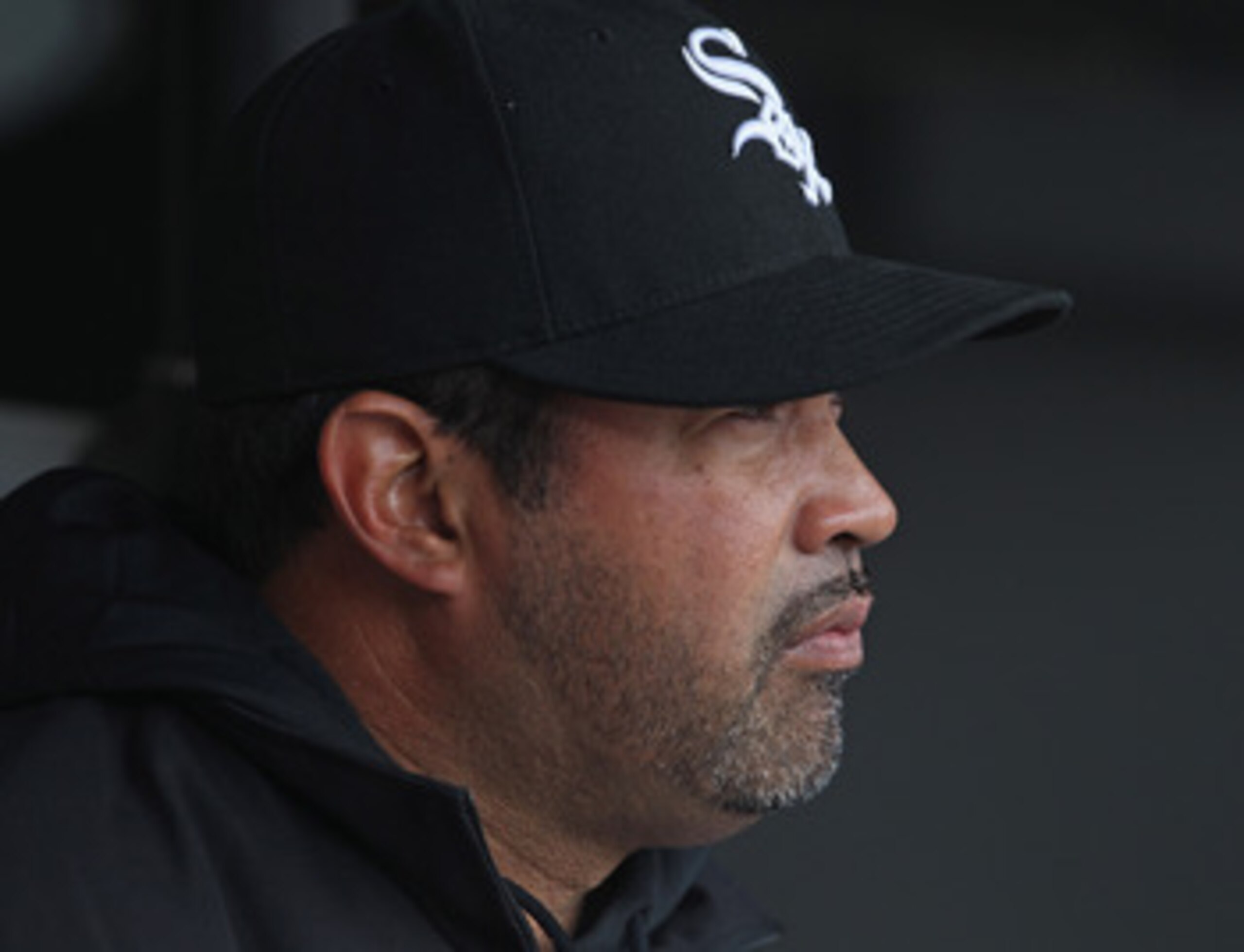 CHICAGO, IL - APRIL 07: Manager Ozzie Guillen #13 of the Chicago White Sox sits in the dugout before the home opener against the Tampa Bay Rays at U.S. Cellular Field on April 7, 2011 in Chicago, Illinois. The White Sox defeated the Rays 5-1. (Photo by Jo