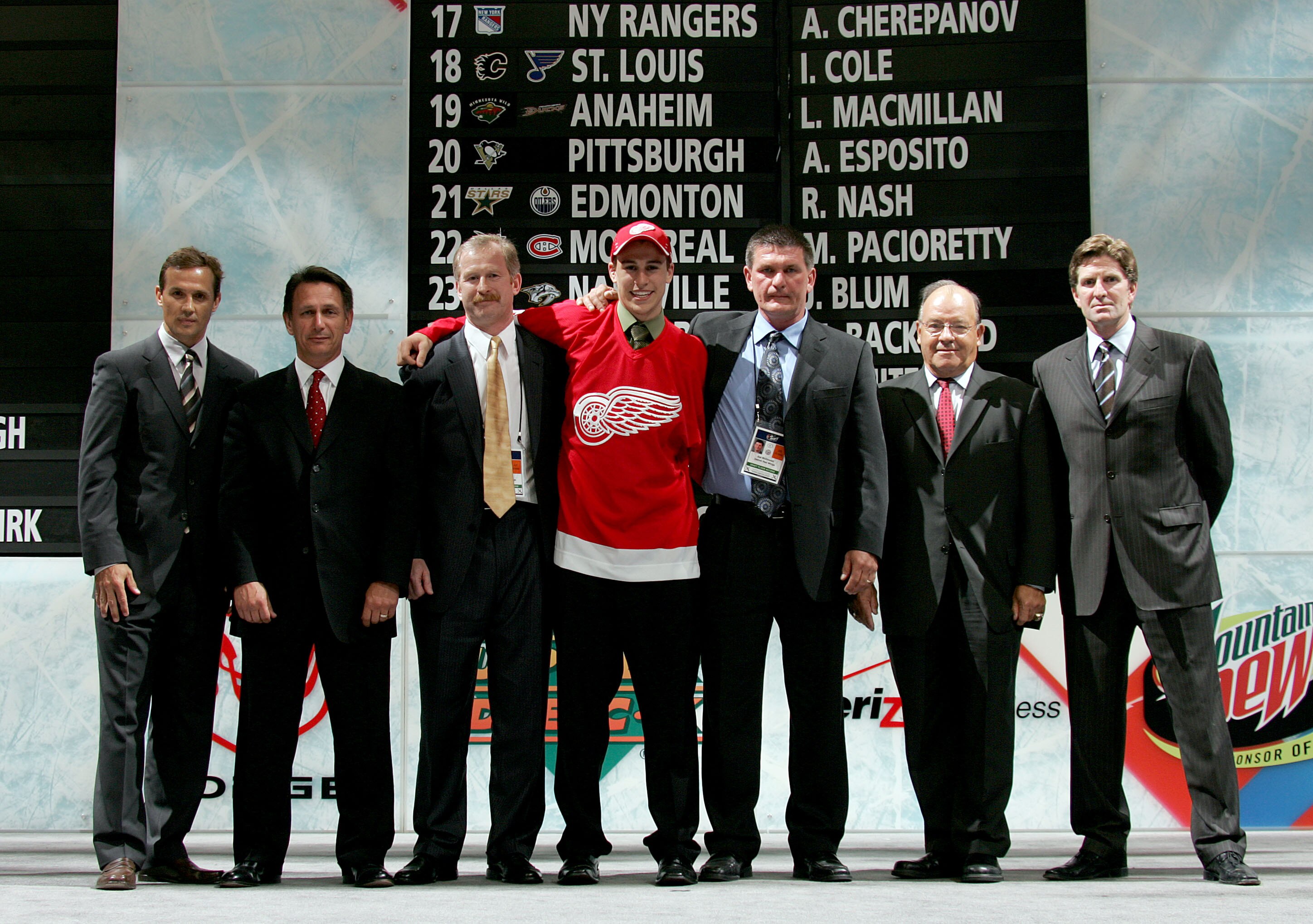 COLUMBUS, OH - JUNE 22:  27th overall pick Brendan Smith of the Detroit Red Wings poses with team personal after being drafted in the first round of the 2007 NHL Entry Draft at Nationwide Arena on June 22, 2007 in Columbus, Ohio.  (Photo by Bruce Bennett/