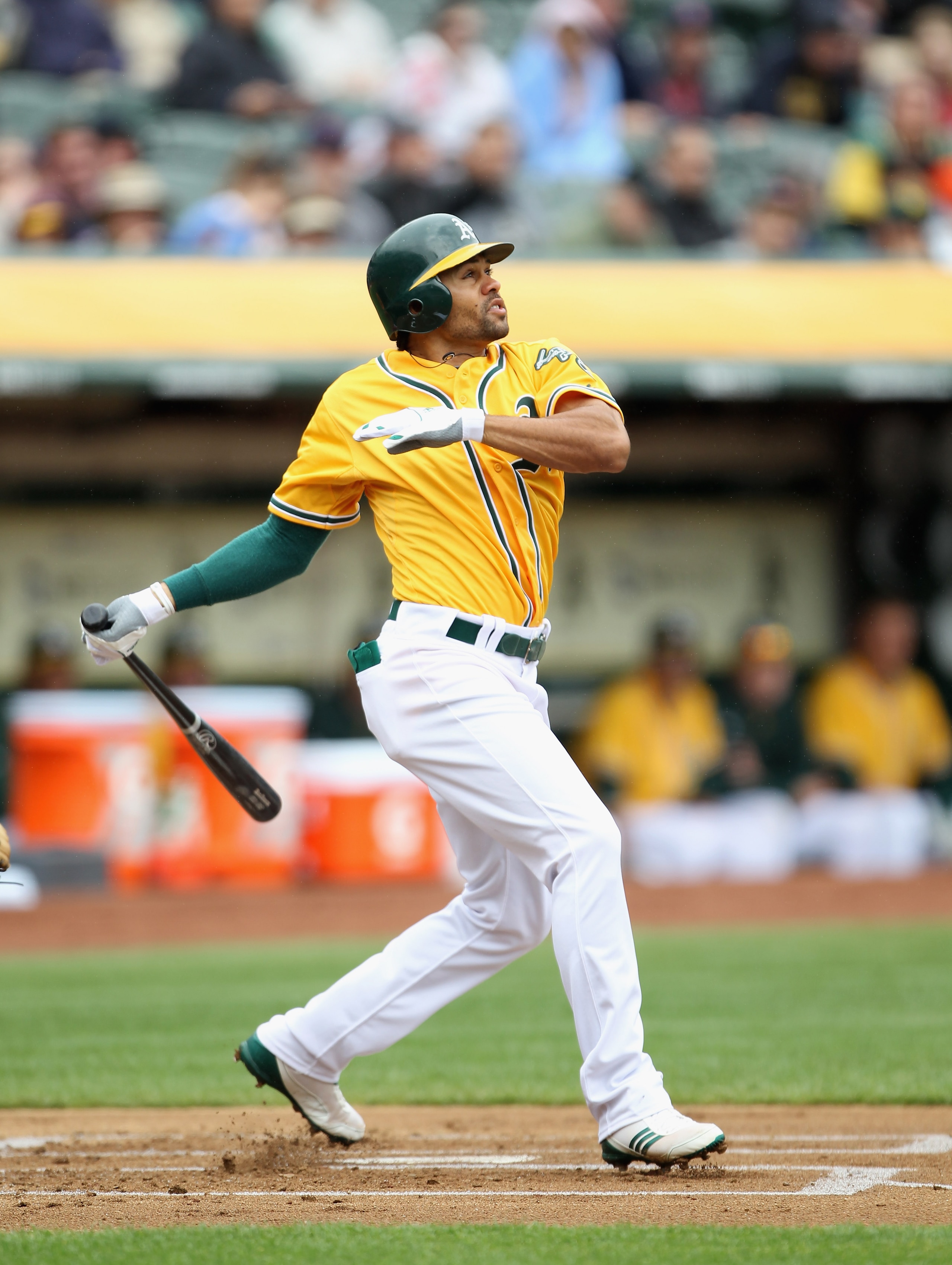OAKLAND, CA - APRIL 20:  Coco Crisp #4 of the Oakland Athletics hits a lead off home run against the Boston Red Sox at Oakland-Alameda County Coliseum on April 20, 2011 in Oakland, California.  (Photo by Ezra Shaw/Getty Images)
