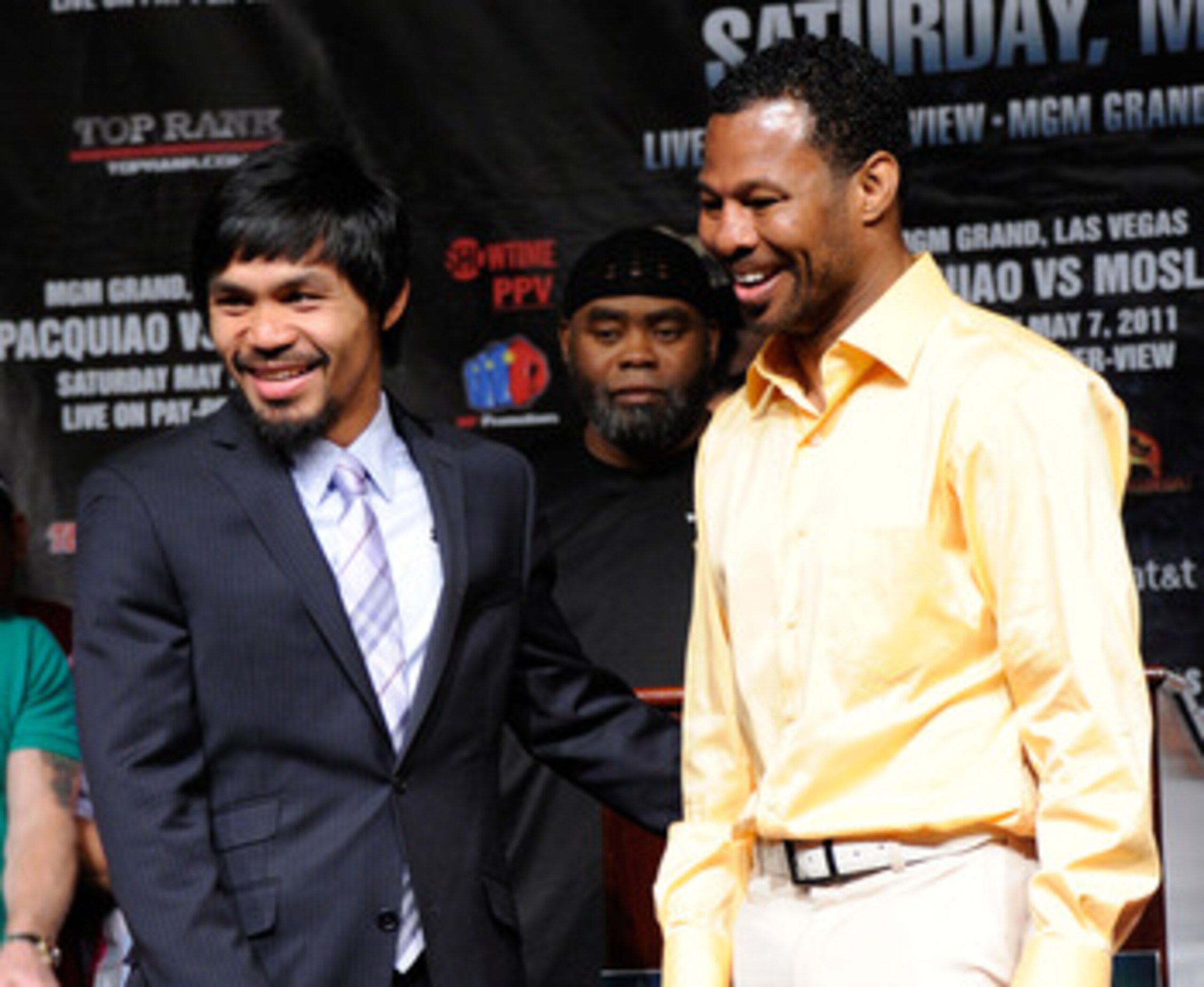 LAS VEGAS, NV - MAY 04:  Boxers Manny Pacquiao (L) and Shane Mosley smile after posing together during the final news conference for their bout at the MGM Grand Hotel/Casino May 4, 2011 in Las Vegas, Nevada. Pacquiao will defend his WBO welterweight title