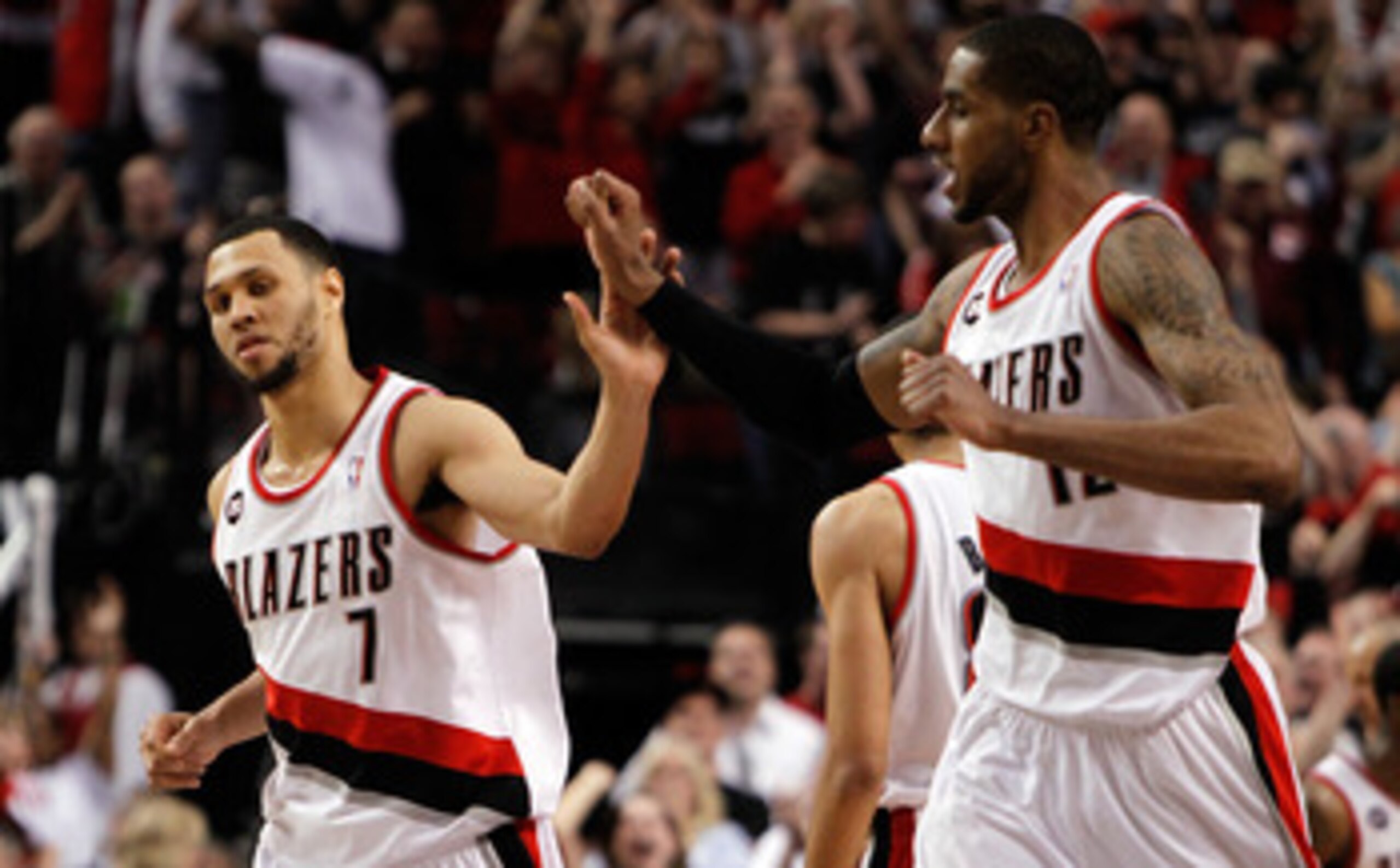 PORTLAND, OR - APRIL 23:  Brandon Roy #7 high fives LaMarcus Aldridge #12 of the Portland Trail Blazers against the Dallas Mavericks in Game Four of the Western Conference Quarterfinals in the 2011 NBA Playoffs on April 23, 2011 at the Rose Garden in Port