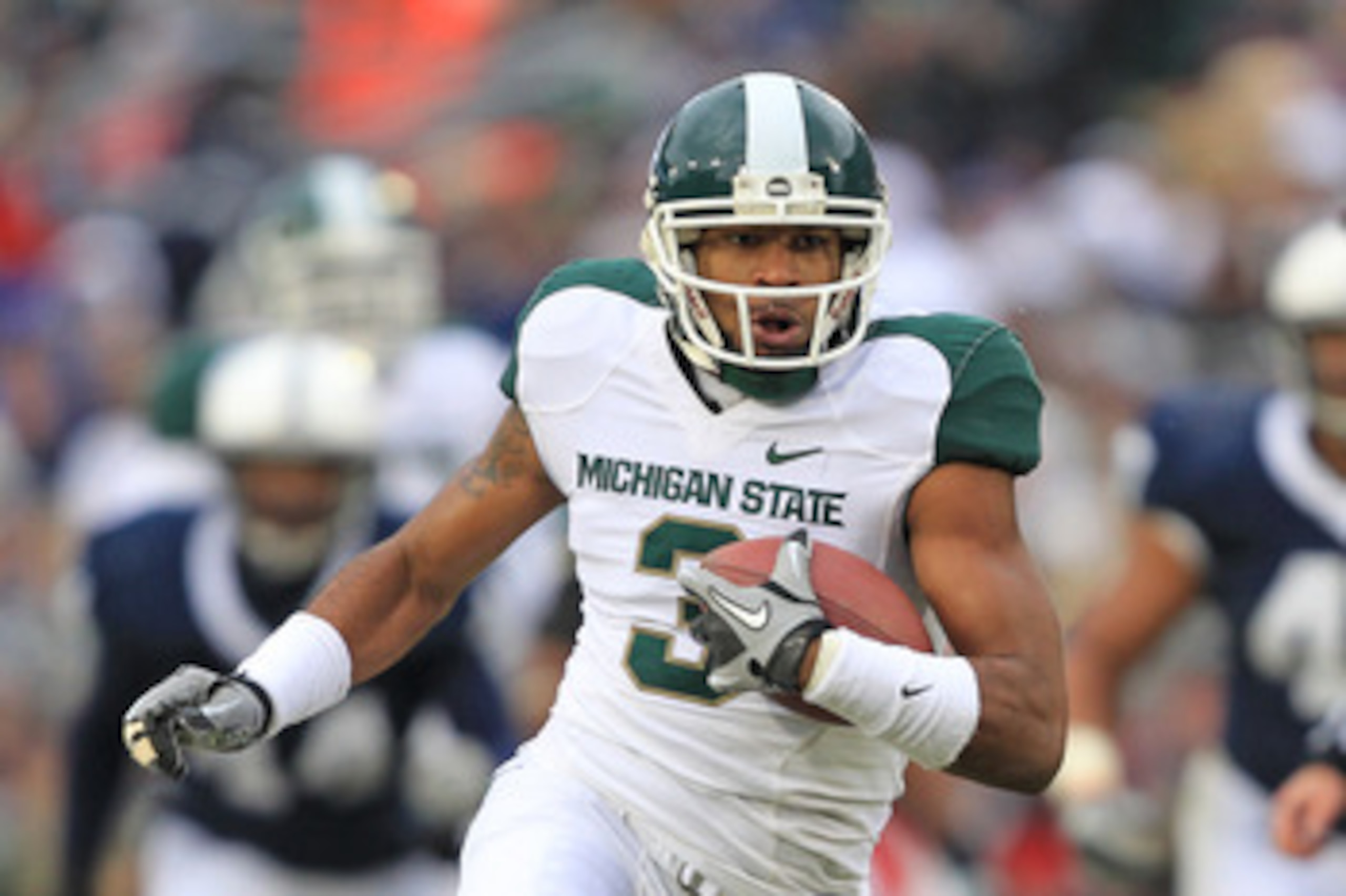 STATE COLLEGE, PA - NOVEMBER 27: Wide receiver B.J. Cunningham #3 of the Michigan State Spartans runs with the ball during a game against the Penn State Nittany Lions on November 27, 2010 at Beaver Stadium in State College, Pennsylvania. The Spartans won