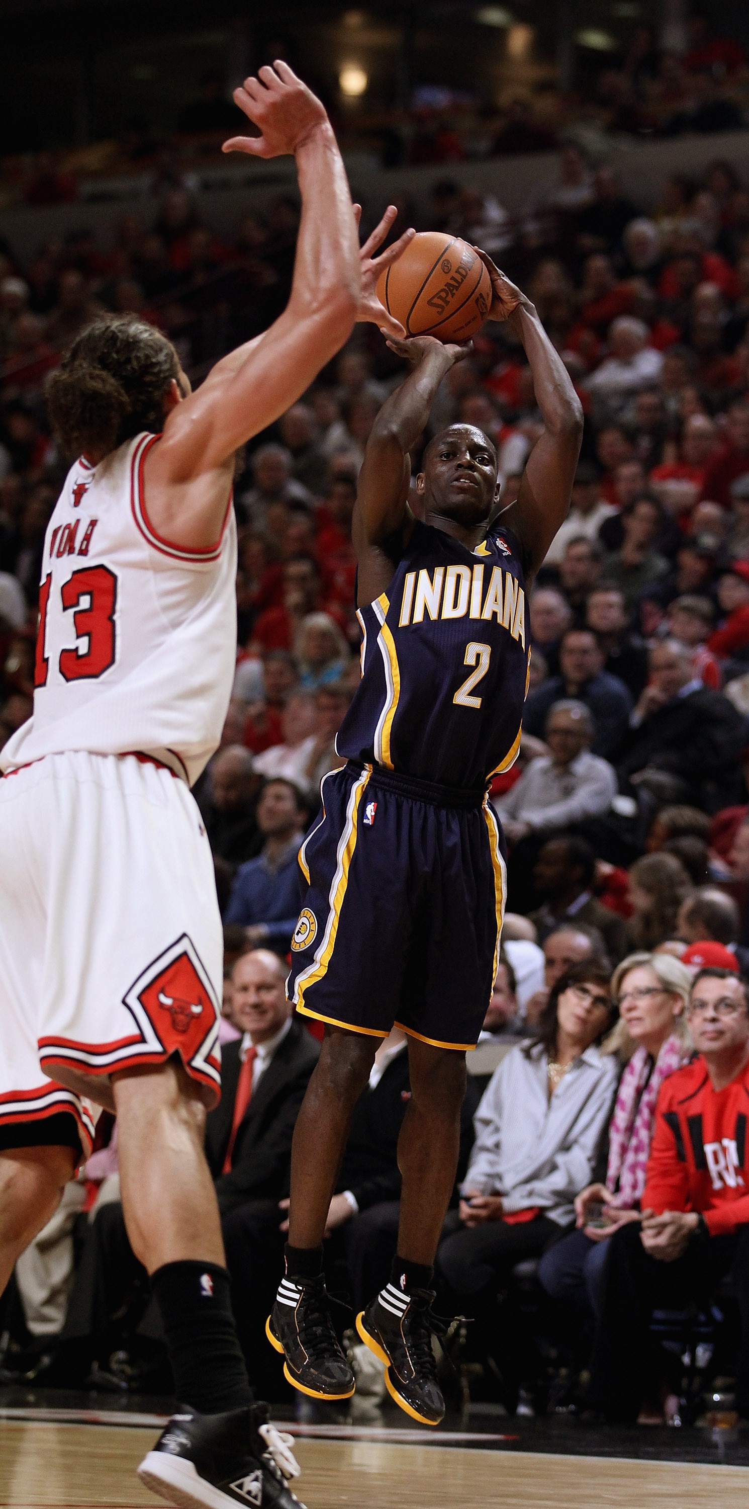 CHICAGO, IL - APRIL 18: Darren Collison #2 of the Indiana Pacers puts up a shot against Joakim Noah #13 of the Chicago Bulls in Game Two of the Eastern Conference Quarterfinals in the 2011 NBA Playoffs at the United Center on April 18, 2011 in Chicago, Il