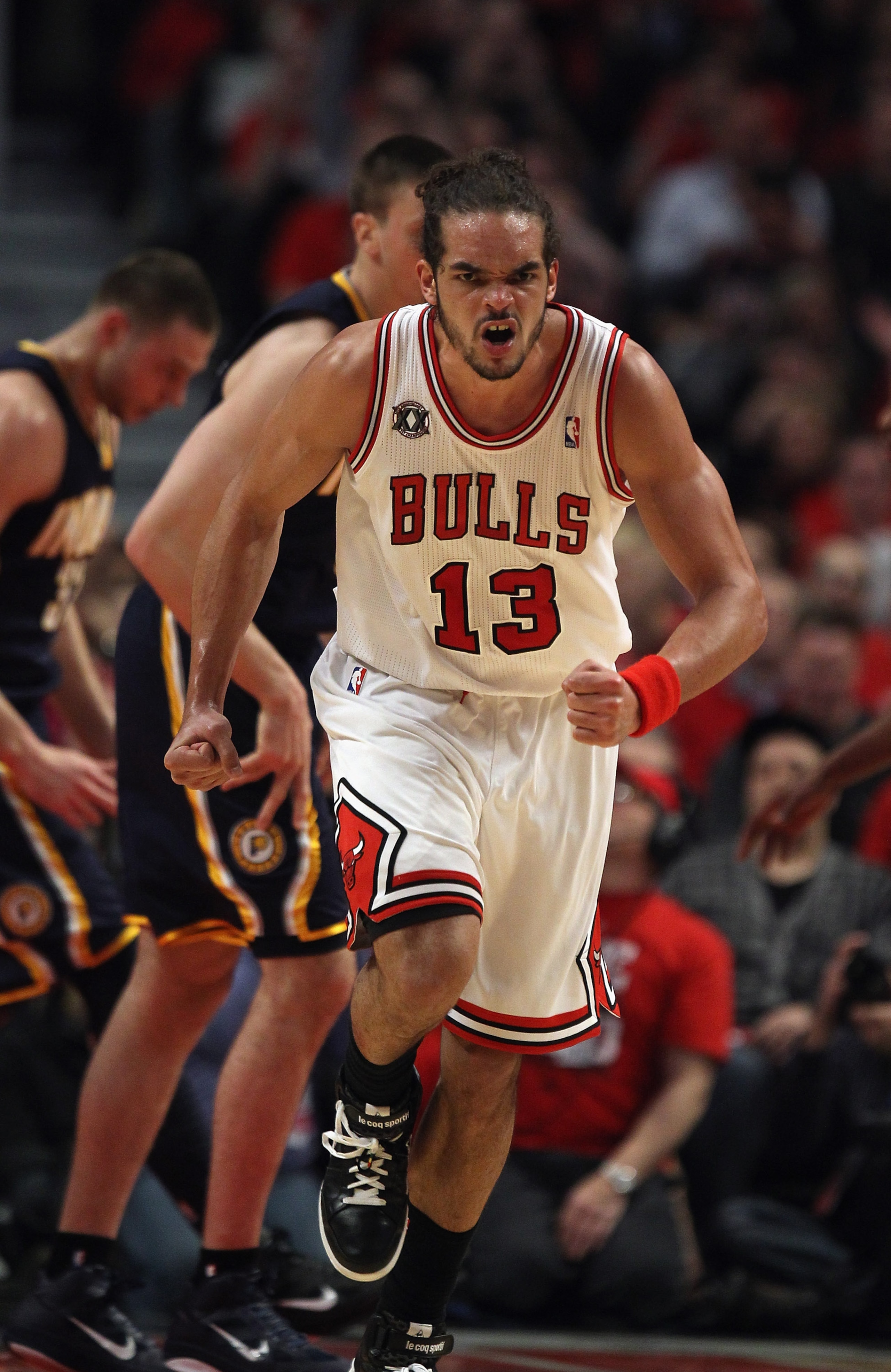 CHICAGO, IL - APRIL 18: Joakim Noah #13 of the Chicago Bulls runs up the court after a dunk against the Indiana Pacers in Game Two of the Eastern Conference Quarterfinals in the 2011 NBA Playoffs at the United Center on April 18, 2011 in Chicago, Illinois