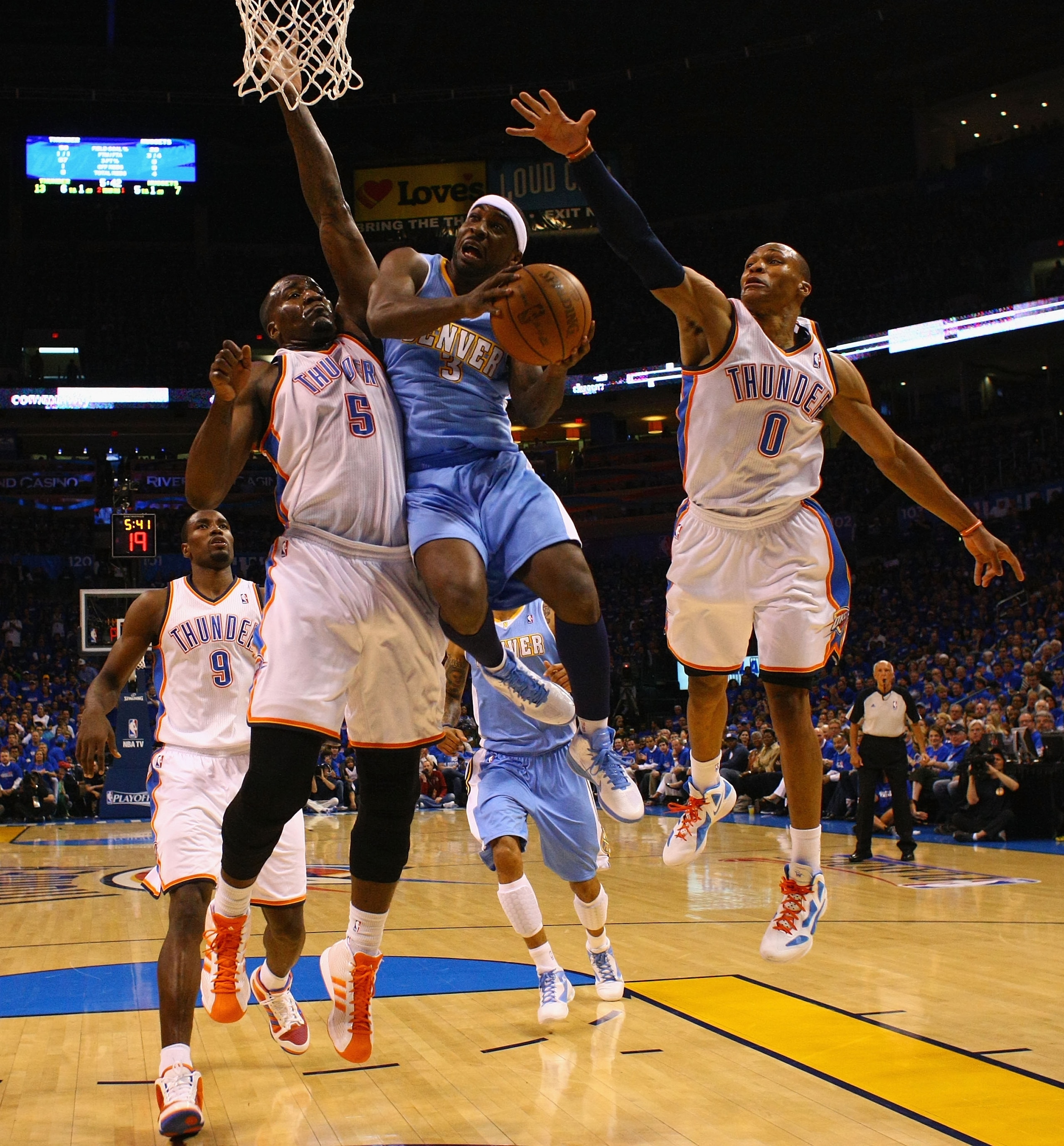 OKLAHOMA CITY, OK - APRIL 20: Ty Lawson #3 of the Denver Nuggets drives to the basket against Kendrick Perkins #5 and Russell Westbrook #0 both of the Oklahoma City Thunder in Game Two of the Western Conference Quarterfinals in the 2011 NBA Playoffs on Ap OKLAHOMA CITY, OK - APRIL 20: Ty Lawson #3 of the Denver Nuggets drives to the basket against Kendrick Perkins #5 and Russell Westbrook #0 both of the Oklahoma City Thunder in Game Two of the Western Conference Quarterfinals in the 2011 NBA Playoffs on Ap