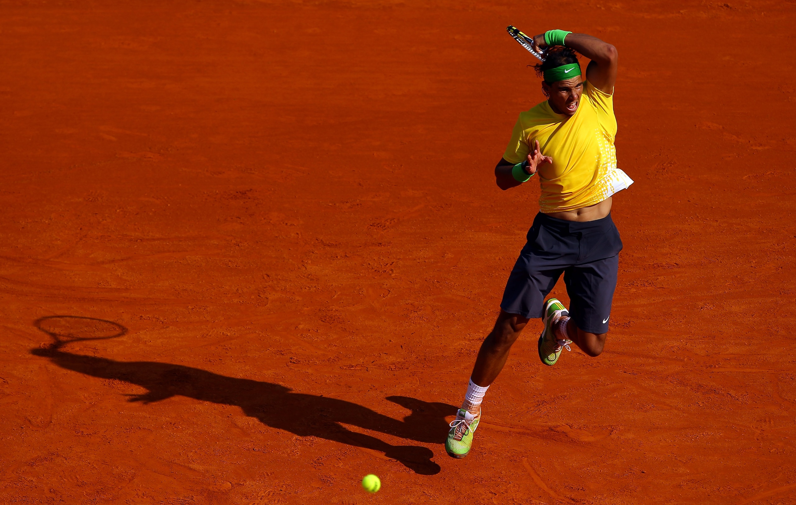 MONACO - APRIL 17:  Rafael Nadal of Spain plays a forehand to David Ferrer of Spain in the final during Day Eight of the ATP Masters Series Tennis at the Monte Carlo Country Club on April 17, 2011 in Monte Carlo, Monaco.  (Photo by Julian Finney/Getty Ima