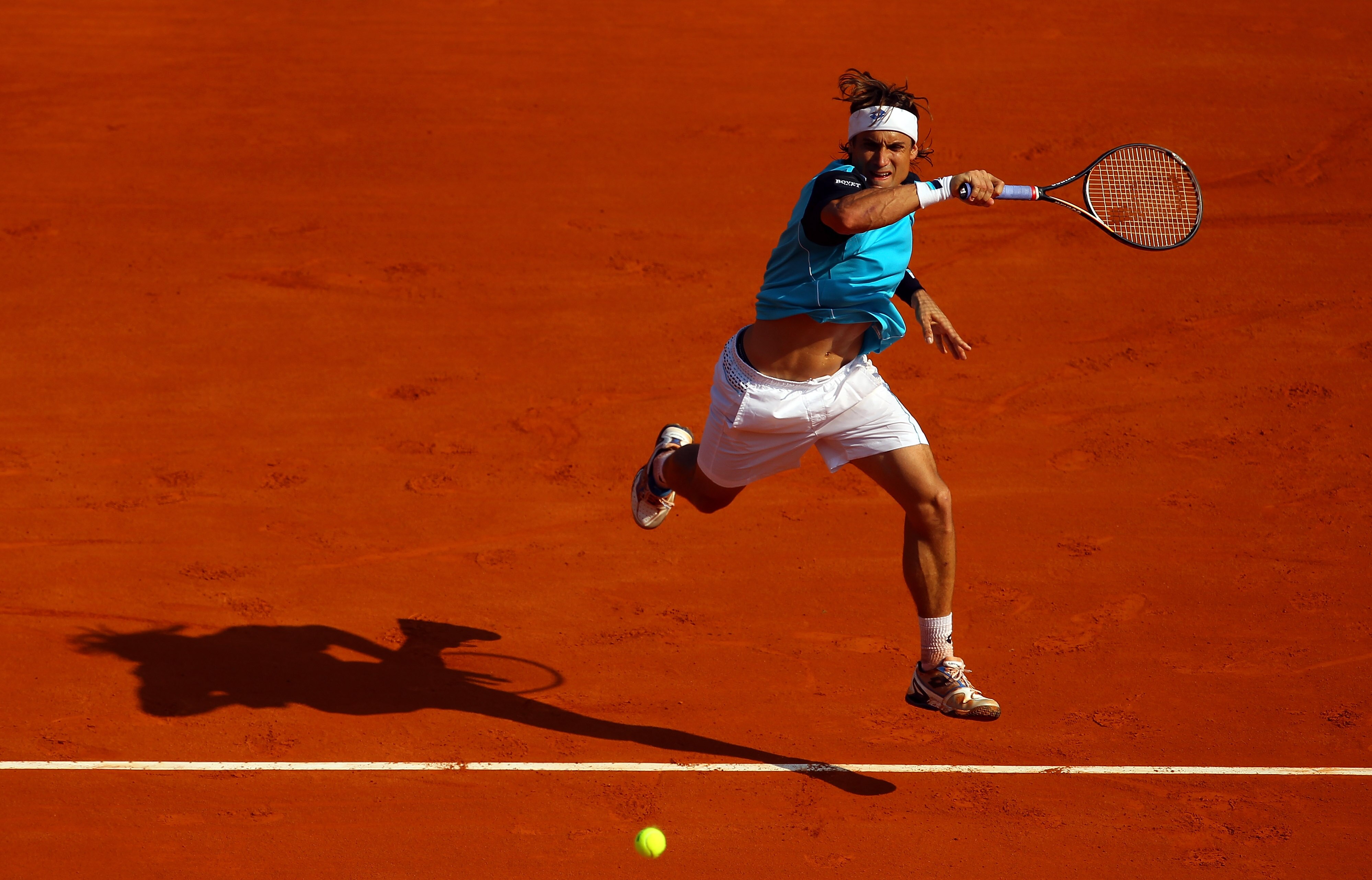 MONACO - APRIL 17:  David Ferrer of Spain plays a forehand in his match against Rafael Nadal of Spain in the final during Day Eight of the ATP Masters Series Tennis at the Monte Carlo Country Club on April 17, 2011 in Monte Carlo, Monaco.  (Photo by Julia