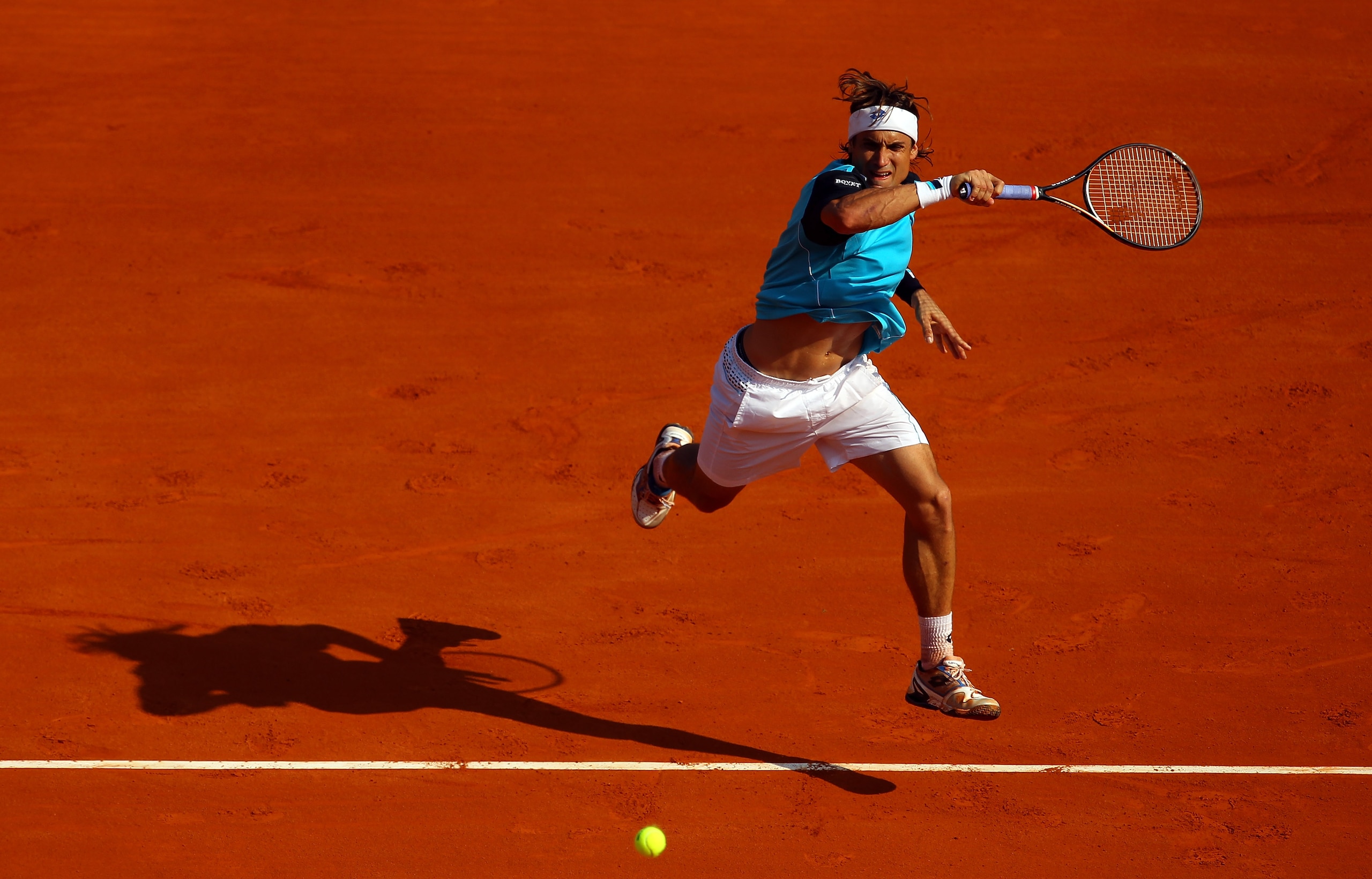 MONACO - APRIL 17:  David Ferrer of Spain plays a forehand in his match against Rafael Nadal of Spain in the final during Day Eight of the ATP Masters Series Tennis at the Monte Carlo Country Club on April 17, 2011 in Monte Carlo, Monaco.  (Photo by Julia