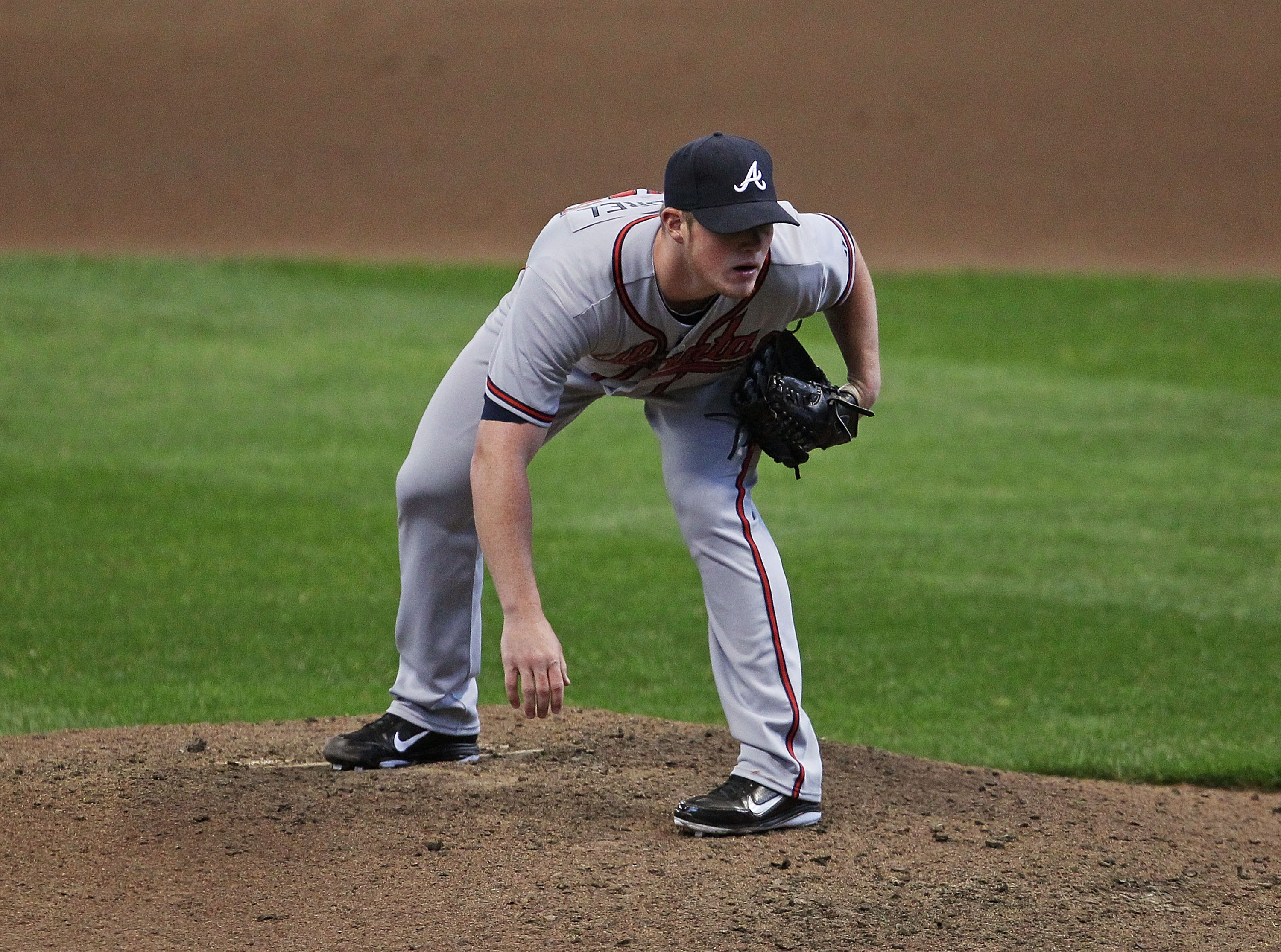 MILWAUKEE, WI - APRIL 04: Craig Kimbrel #46 of the Atlanta Braves looks for the catchers signs in the 9th inning against the Milwaukee Brewers during the home opener at Miller Park on April 4, 2011 in Milwaukee, Wisconsin. The Braves defeated the Brewers