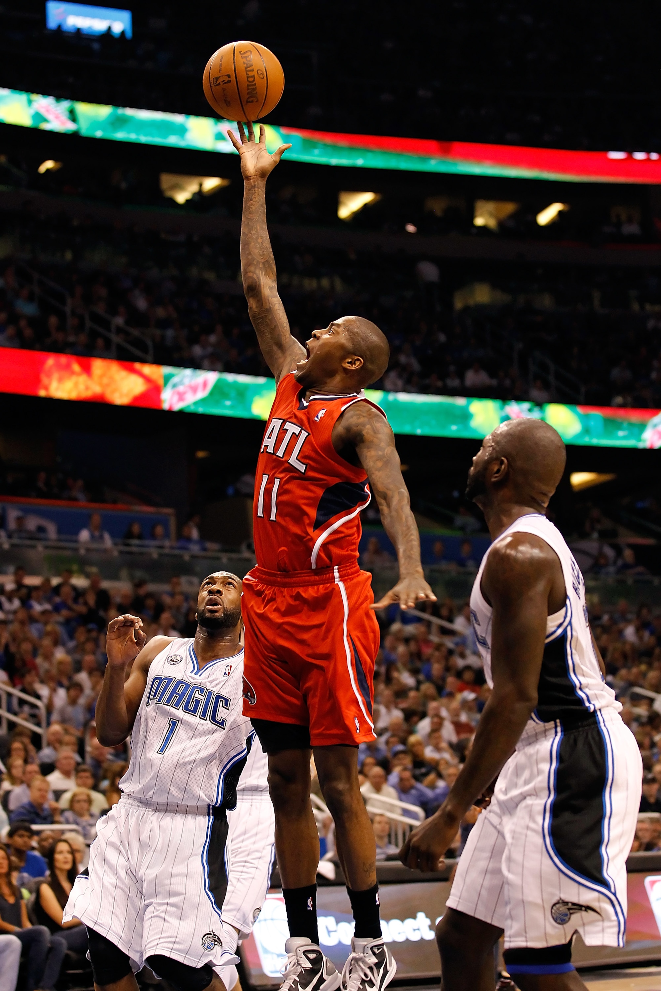 ORLANDO, FL - APRIL 16:  Jamal Crawford #11 of the Atlanta Hawks lays the ball up against the Orlando Magic during Game One of the Eastern Conference Quarterfinals of the 2011 NBA Playoffs on April 16, 2011 at the Amway Arena in Orlando, Florida.  NOTE TO