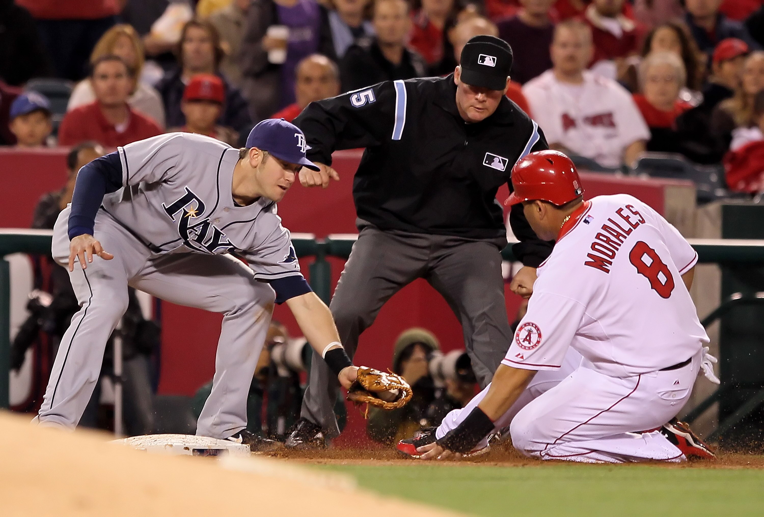 ANAHEIM, CA - MAY 10:  Kendry Morales #8 of the Los Angeles Angels of Anaheim is caught stealing third base by Evan Longoria #3 of the Tampa Bay Rays in the third inning at Angel Stadium on May 10, 2010 in Anaheim, California. The Angels defeated the Rays