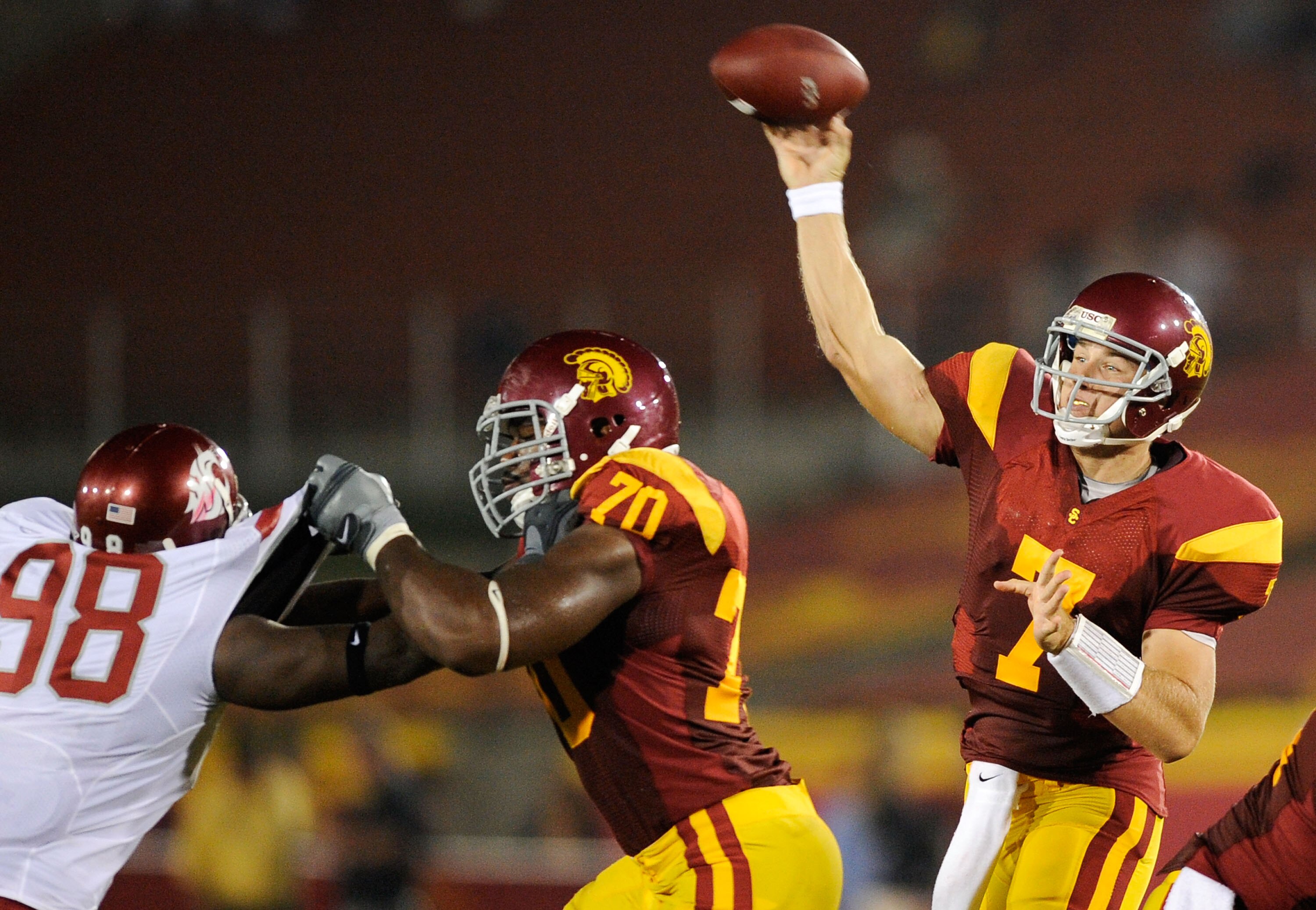 LOS ANGELES, CA - SEPTEMBER 26: Quarterback Matt Barkley #7 of the USC Trojans throws a pass as Tyron Smith #70 blocks Jesse Feagin #98 of the Washington State Cougars during the second quarter of the college football game at the Los Angeles Memorial C LOS ANGELES, CA - SEPTEMBER 26: Quarterback Matt Barkley #7 of the USC Trojans throws a pass as Tyron Smith #70 blocks Jesse Feagin #98 of the Washington State Cougars during the second quarter of the college football game at the Los Angeles Memorial C
