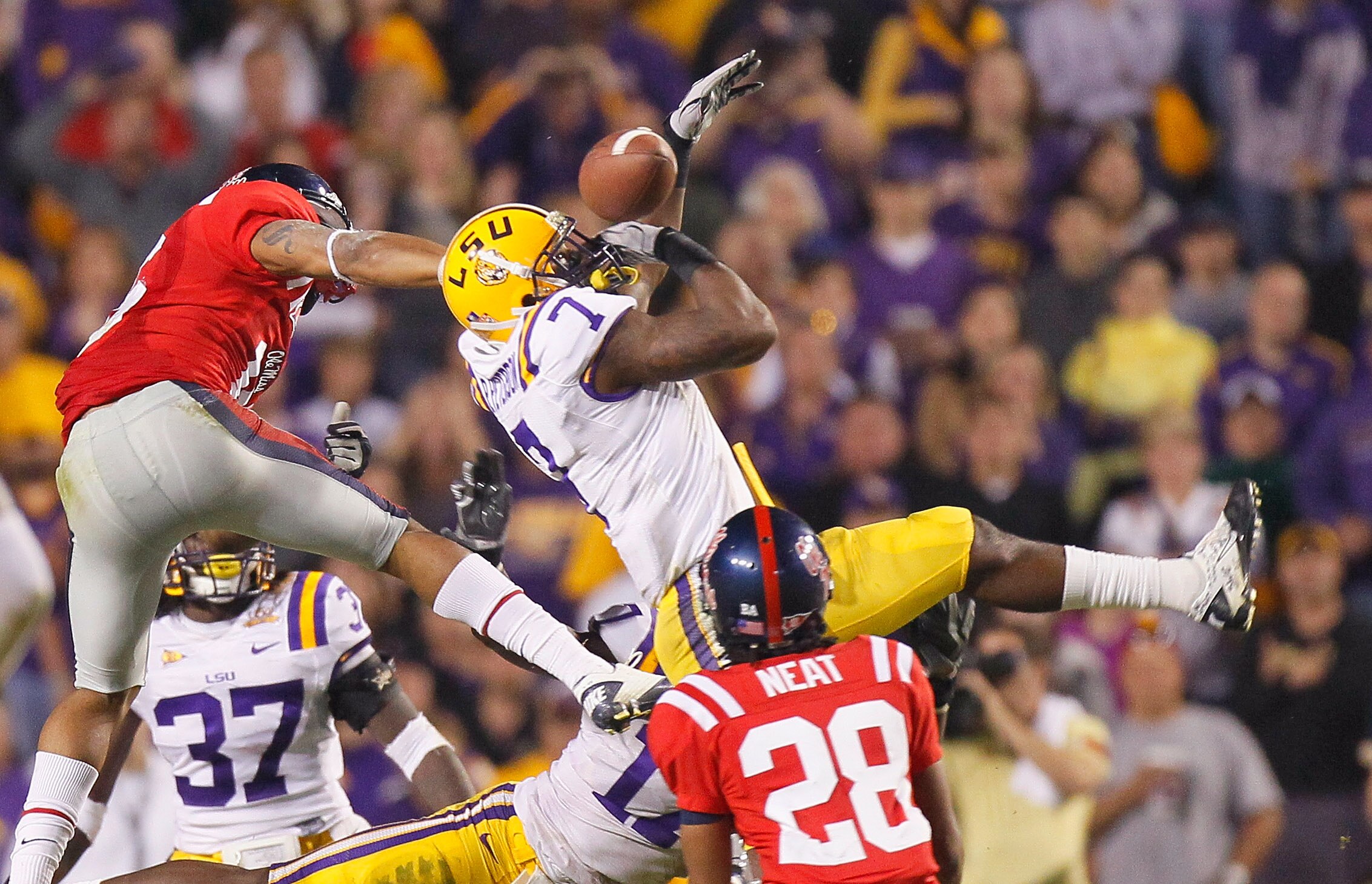 BATON ROUGE, LA - NOVEMBER 20: Patrick Peterson #7 of the Louisiana State University Tigers nearly intercepts a pass in the final seconds against Markeith Summers #16 and Korvic Neat #28 of the Ole Miss Rebels as time expired at Tiger Stadium on November BATON ROUGE, LA - NOVEMBER 20: Patrick Peterson #7 of the Louisiana State University Tigers nearly intercepts a pass in the final seconds against Markeith Summers #16 and Korvic Neat #28 of the Ole Miss Rebels as time expired at Tiger Stadium on November