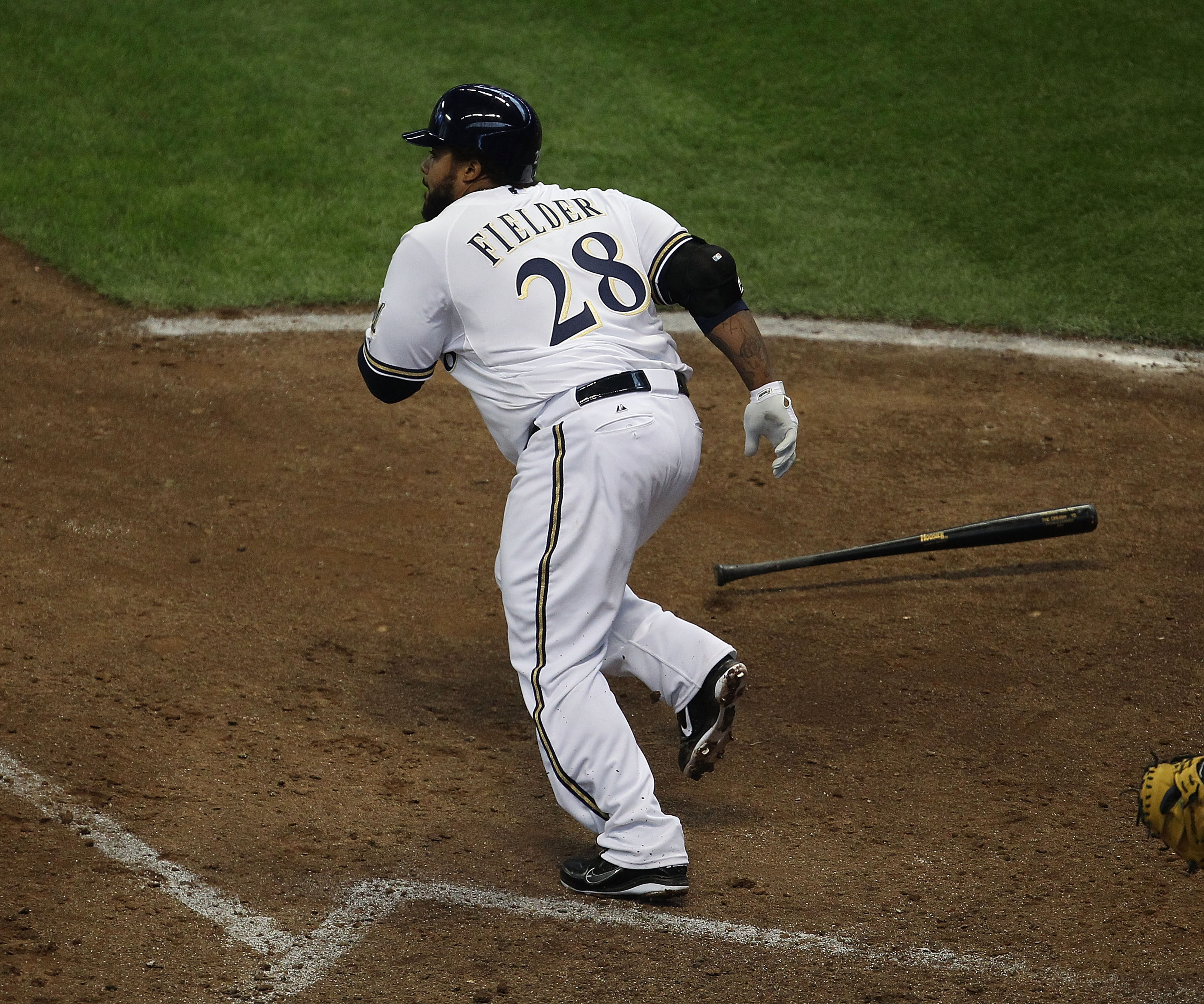 MILWAUKEE, WI - APRIL 04: Prince Fielder #28 of the Milwaukee Brewers runs after hitting the ball against the Atlanta Braves during the home opener at Miller Park on April 4, 2011 in Milwaukee, Wisconsin. The Braves defeated the Brewers 2-1.  (Photo by Jo
