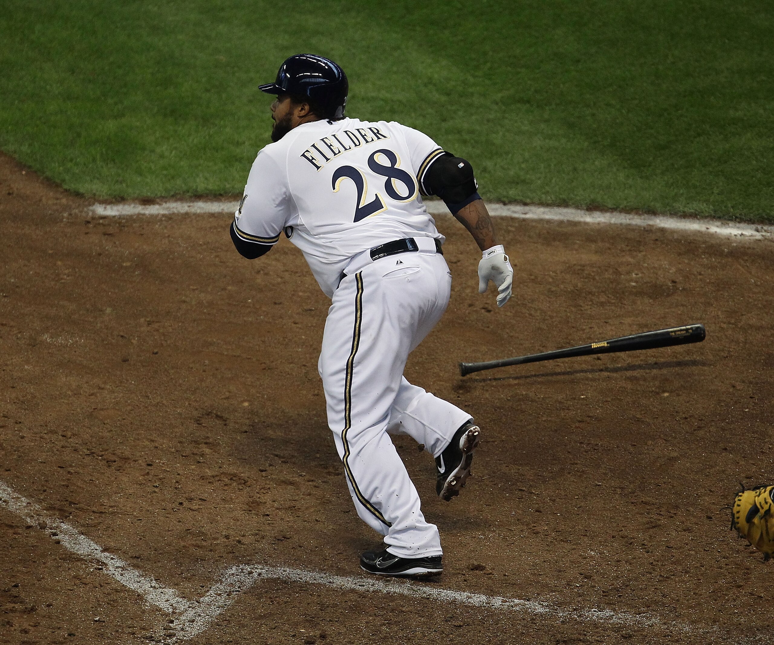 MILWAUKEE, WI - APRIL 04: Prince Fielder #28 of the Milwaukee Brewers runs after hitting the ball against the Atlanta Braves during the home opener at Miller Park on April 4, 2011 in Milwaukee, Wisconsin. The Braves defeated the Brewers 2-1.  (Photo by Jo
