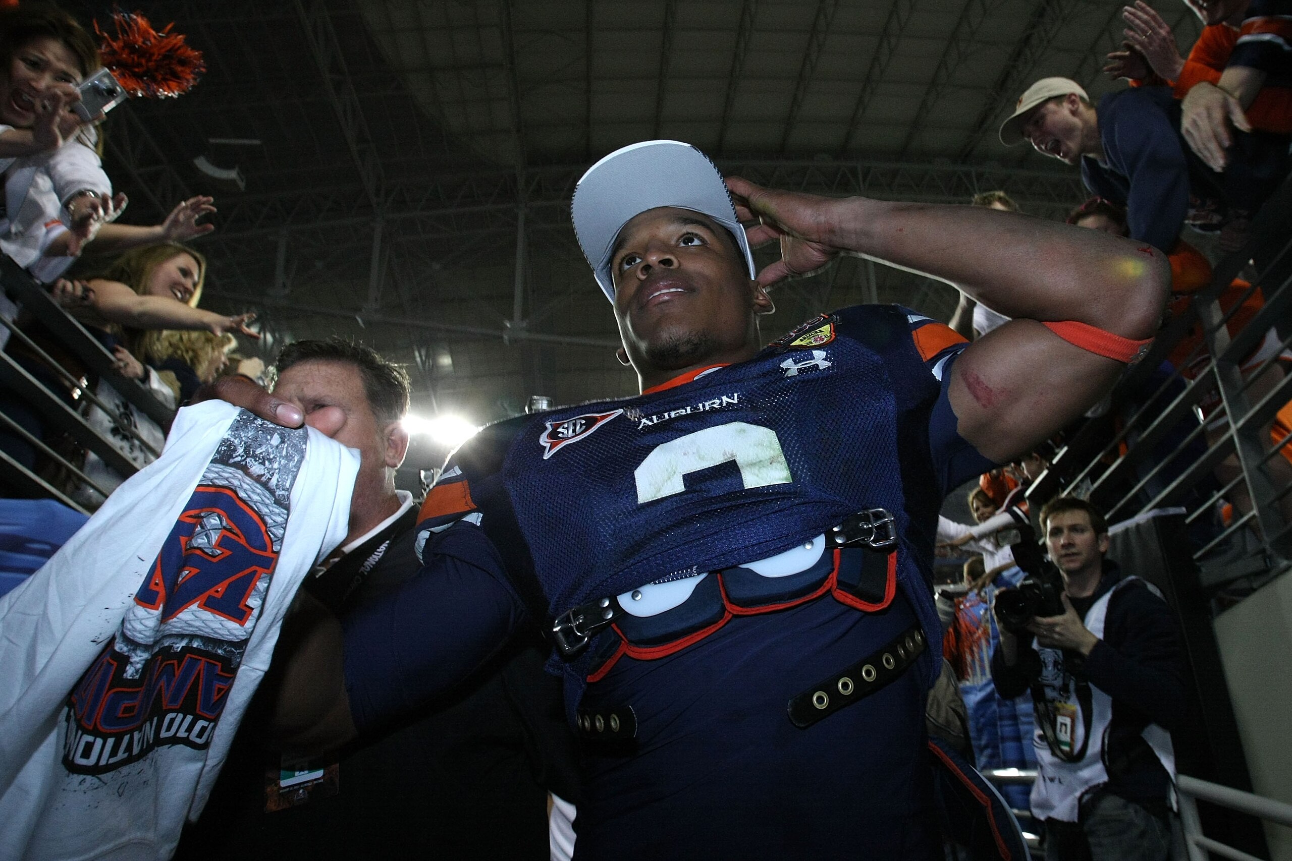 GLENDALE, AZ - JANUARY 10: Quarterback Cameron Newton #2 of the Auburn Tigers celebrates the Tigers 22-19 victory against the Oregon Ducks in the Tostitos BCS National Championship Game at University of Phoenix Stadium on January 10, 2011 in Glendale, Ar GLENDALE, AZ - JANUARY 10: Quarterback Cameron Newton #2 of the Auburn Tigers celebrates the Tigers 22-19 victory against the Oregon Ducks in the Tostitos BCS National Championship Game at University of Phoenix Stadium on January 10, 2011 in Glendale, Ar
