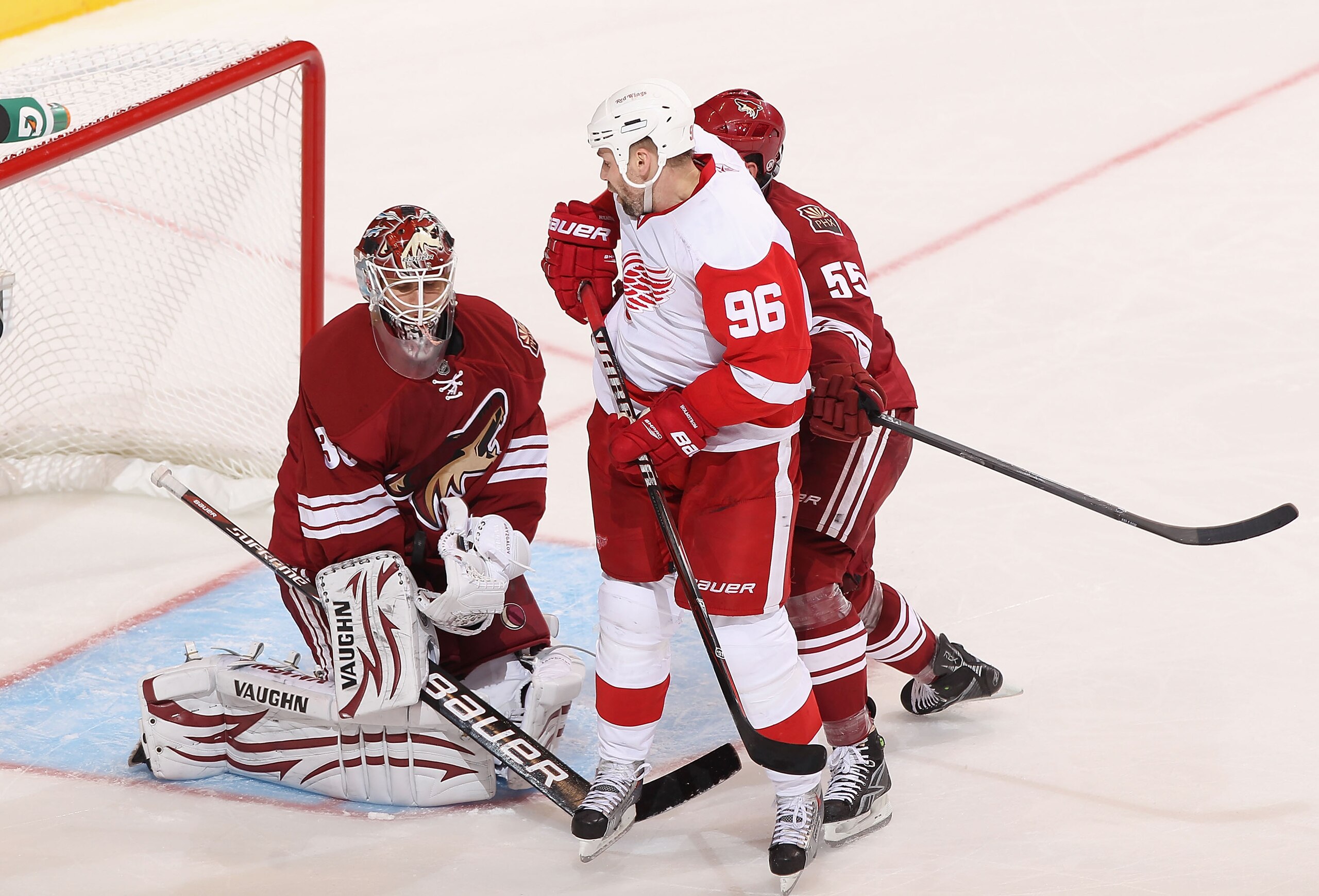 GLENDALE, AZ - APRIL 20: Goaltender Ilya Bryzgalov #30 of the Phoenix Coyotes makes a save on the shot as Tomas Holmstrom #96 of the Detroit Red Wings looks for a rebound in Game Four of the Western Conference Quarterfinals during the 2011 NHL Stanley Cu GLENDALE, AZ - APRIL 20: Goaltender Ilya Bryzgalov #30 of the Phoenix Coyotes makes a save on the shot as Tomas Holmstrom #96 of the Detroit Red Wings looks for a rebound in Game Four of the Western Conference Quarterfinals during the 2011 NHL Stanley Cu