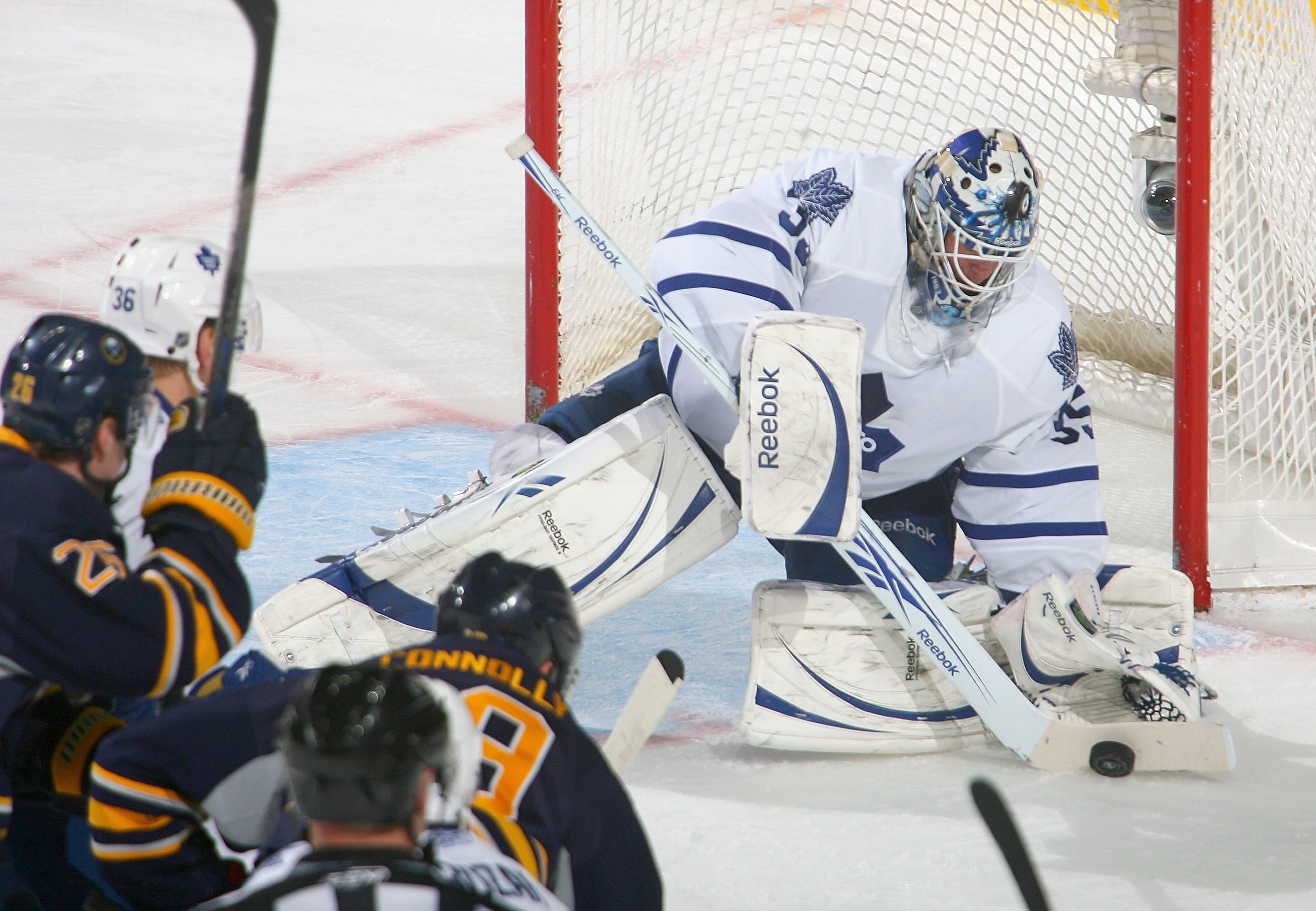 BUFFALO, NY - FEBRUARY 16: Jean-Sebastien Giguere #35 of the Toronto Maple Leafs covers up on a shot by Tim Connolly #19 of the Buffalo Sabres  at HSBC Arena on February 16, 2011 in Buffalo, New York.  (Photo by Rick Stewart/Getty Images)