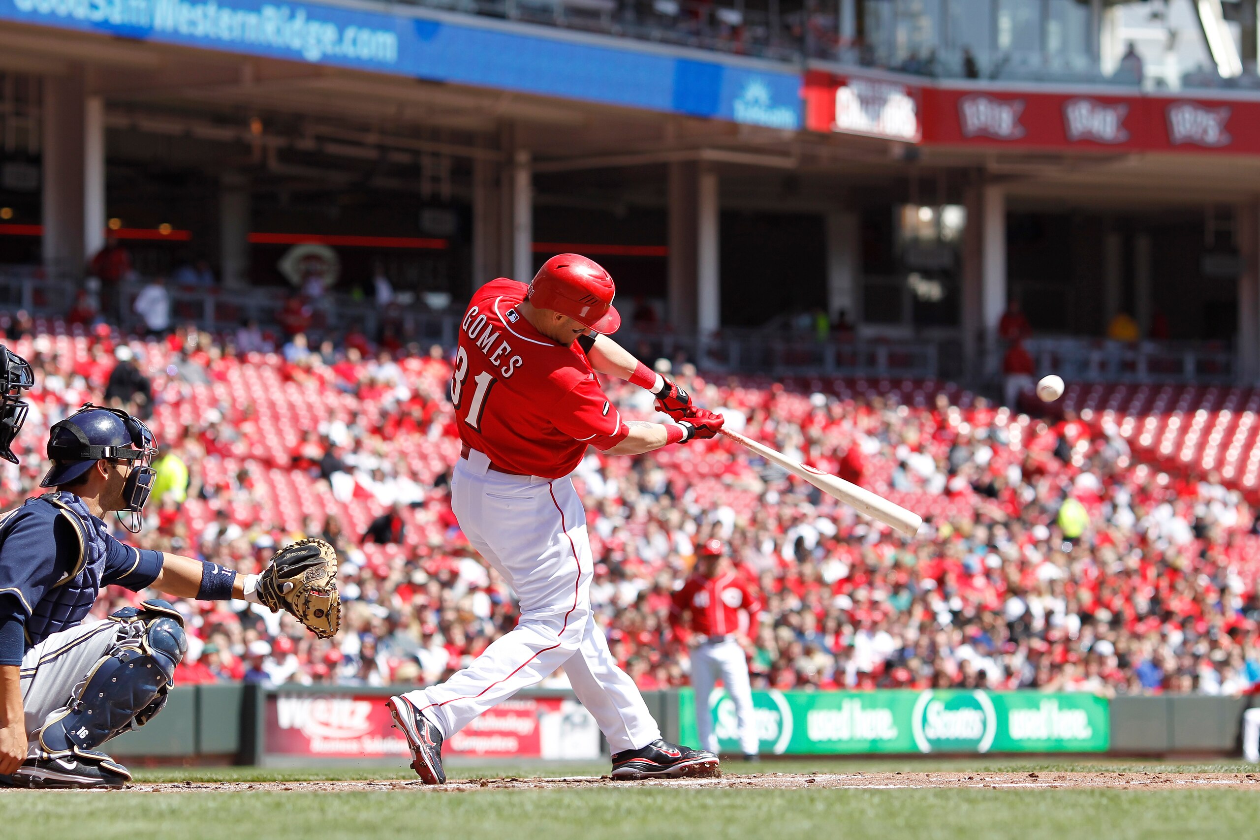 CINCINNATI, OH - APRIL 3: Jonny Gomes #31 of the Cincinnati Reds follows through on a solo home run in the 1st inning against the Milwaukee Brewers at Great American Ball Park on April 3, 2011 in Cincinnati, Ohio. The Reds won 12-3. (Photo by Joe Robbins/