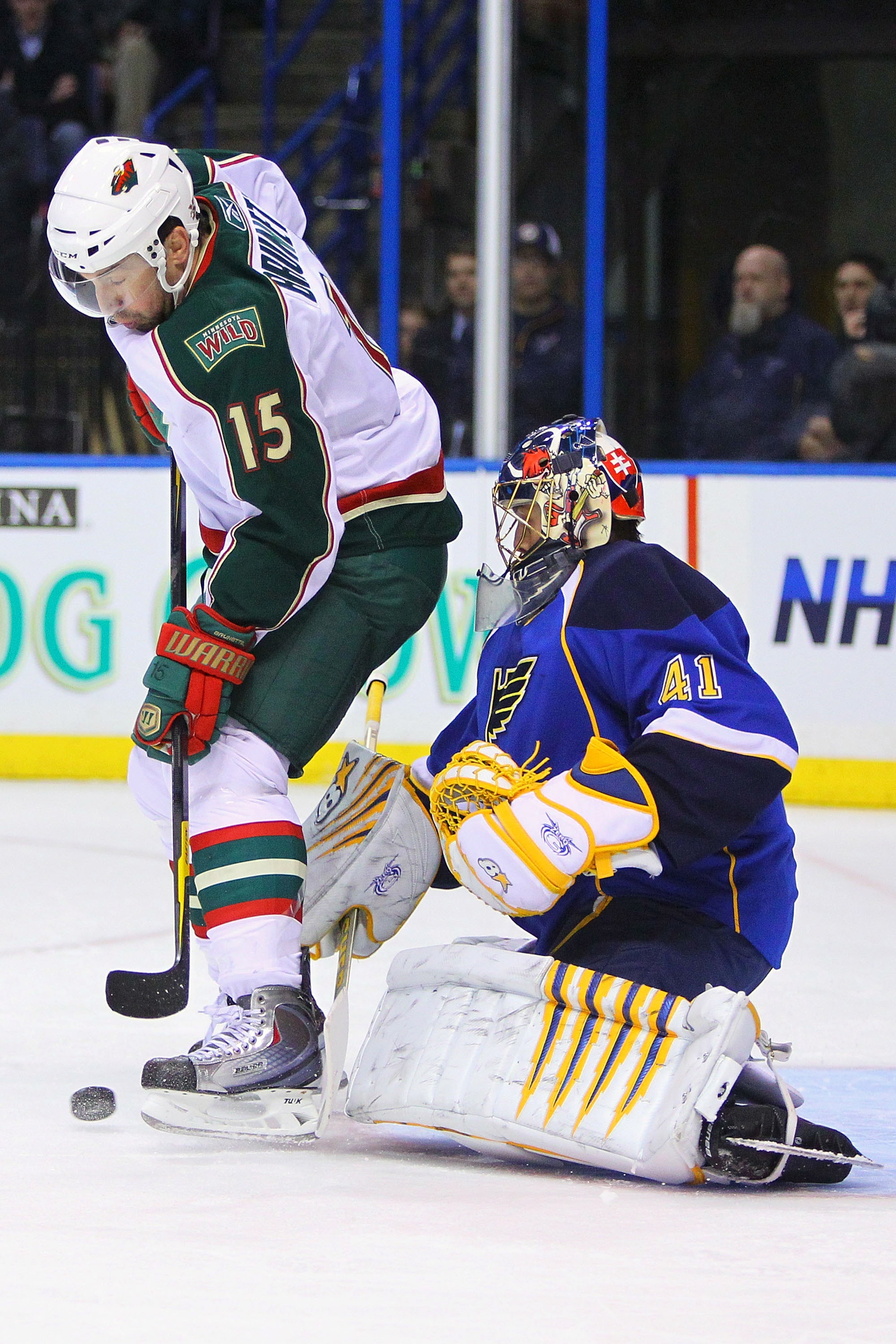 ST. LOUIS, MO - MARCH 29: Andrew Brunette #15 of the Minnesota Wild  looks to get the puck past Jaroslav Halak #41 of the St. Louis Blues at the Scottrade Center on March 29, 2011 in St. Louis, Missouri.  (Photo by Dilip Vishwanat/Getty Images)