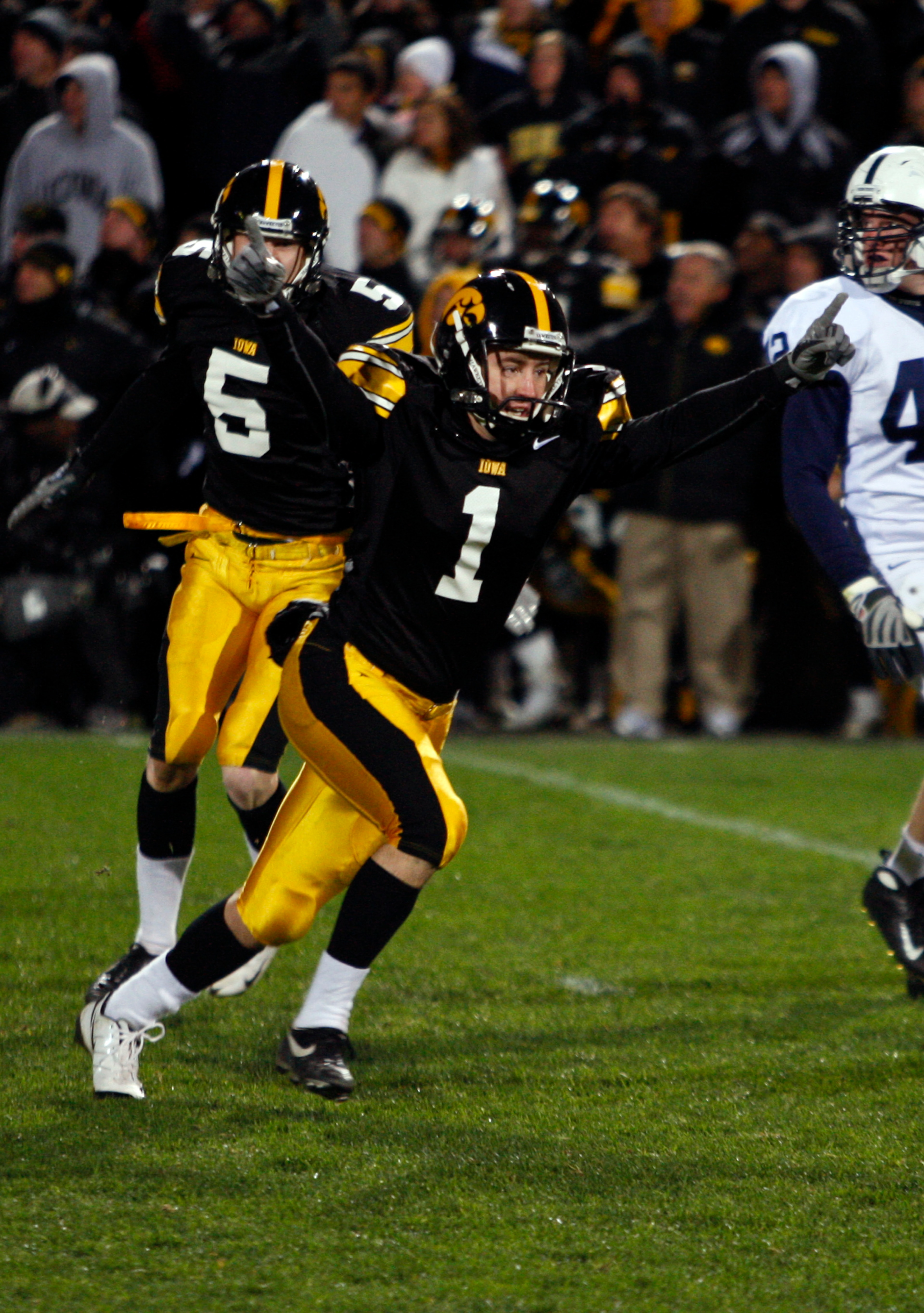 IOWA CITY, IA - NOVEMBER 8: Iowa Kicker Daniel Murray #1 celebrates with teammate Ryan Donahue #5 after kicking the game winning field goal defeating Penn State Nittany Lions with six seconds left on the clock at Kinnick Stadium on November 8, 2008 in Io IOWA CITY, IA - NOVEMBER 8: Iowa Kicker Daniel Murray #1 celebrates with teammate Ryan Donahue #5 after kicking the game winning field goal defeating Penn State Nittany Lions with six seconds left on the clock at Kinnick Stadium on November 8, 2008 in Io