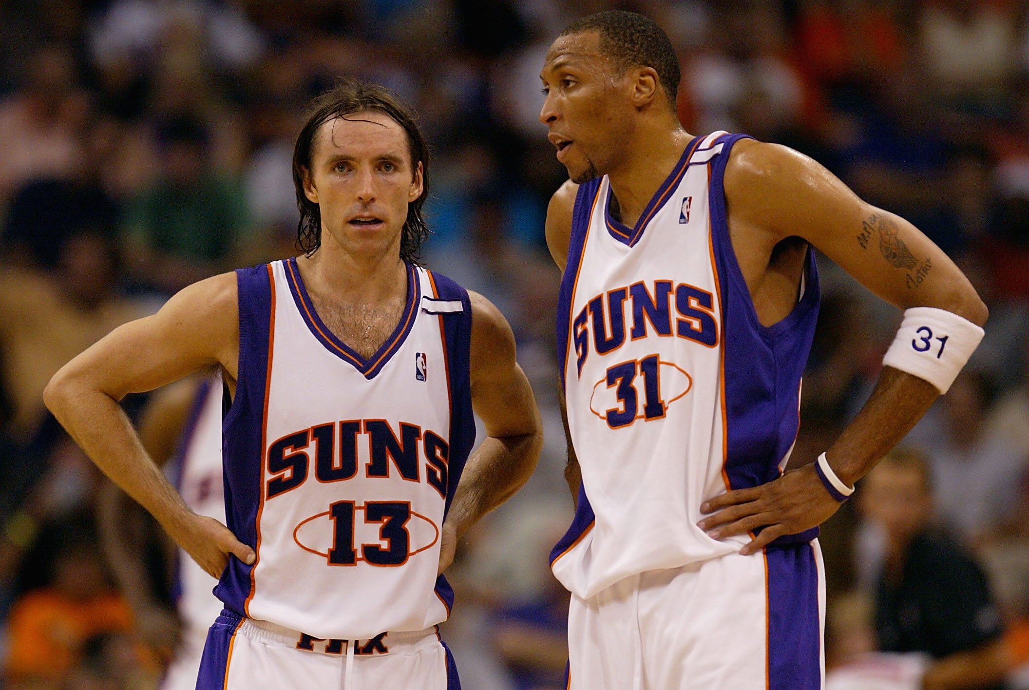 PHOENIX - MAY 24:  Steve Nash #13 and Shawn Marion #31 of the Phoenix Suns talk on the court during a break in the action against the San Antonio Spurs in Game two of the Western Conference Finals during the 2005 NBA Playoffs at America West Arena on May
