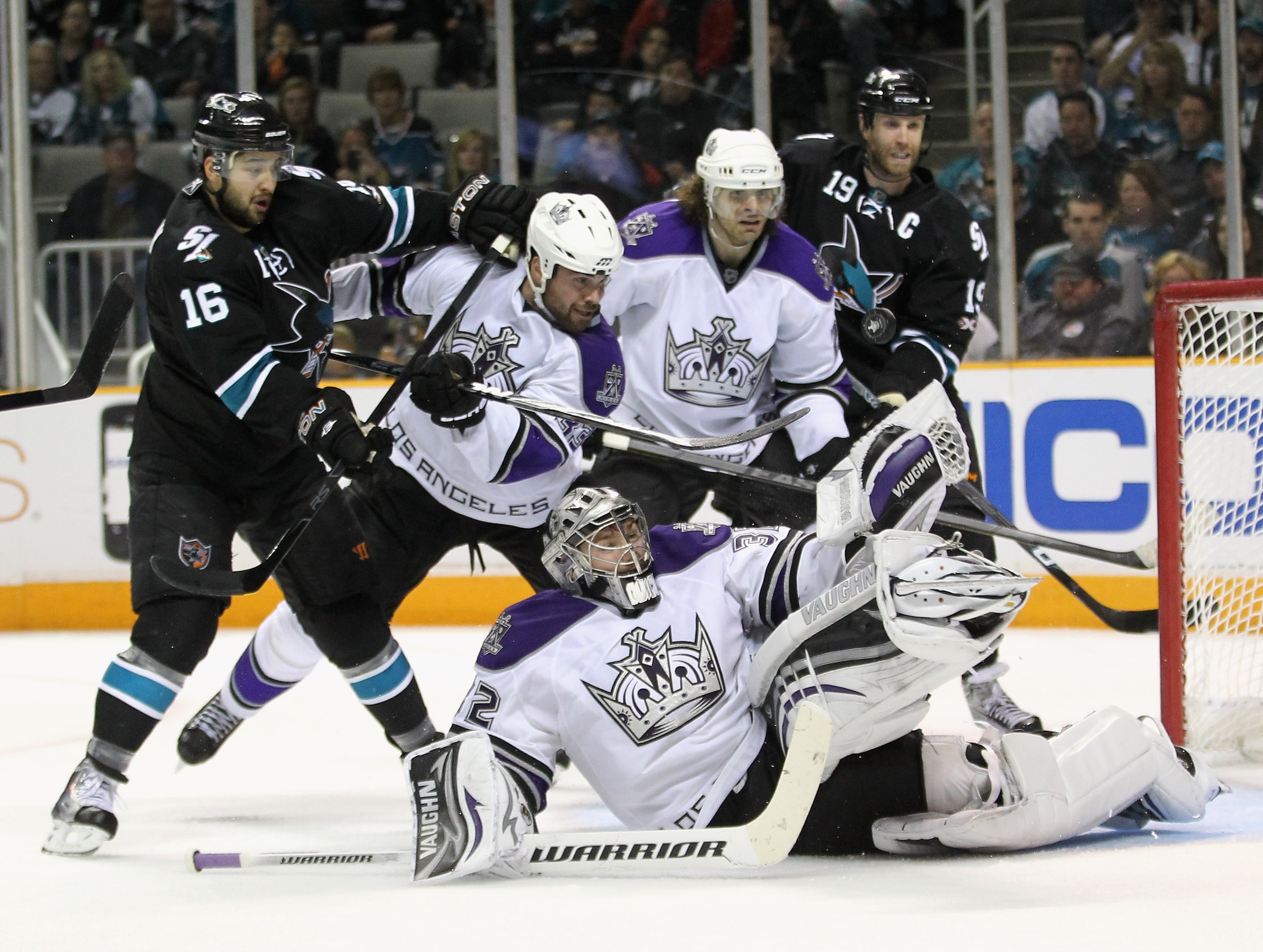 SAN JOSE, CA - APRIL 23: Willie Mitchell #33 and Michal Handzus #26 of the Los Angeles Kings and Devin Setoguchi #16 and Joe Thornton #19 of the San Jose Sharks look on against the San Jose Sharks Jonathan Quick #32 of the Los Angeles Kings makes a divin SAN JOSE, CA - APRIL 23: Willie Mitchell #33 and Michal Handzus #26 of the Los Angeles Kings and Devin Setoguchi #16 and Joe Thornton #19 of the San Jose Sharks look on against the San Jose Sharks Jonathan Quick #32 of the Los Angeles Kings makes a divin