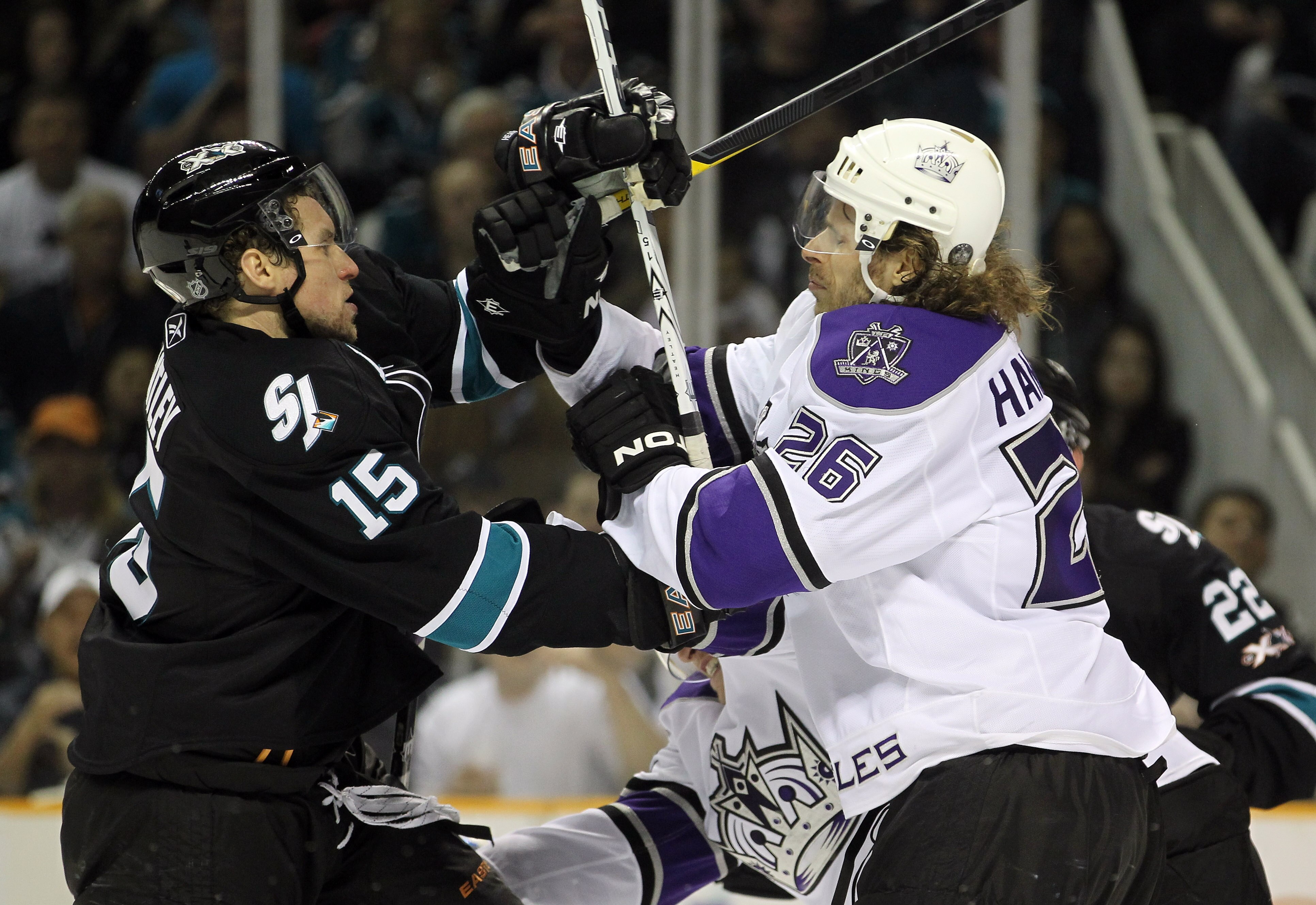 SAN JOSE, CA - APRIL 23:  Dany Heatley #15 of the San Jose Sharks and Michal Handzus #26 of the Los Angeles Kings get in to a fight in game five of the Western Conference Quarterfinals during the 2011 NHL Stanley Cup Playoffs at HP Pavilion on April 23, 2