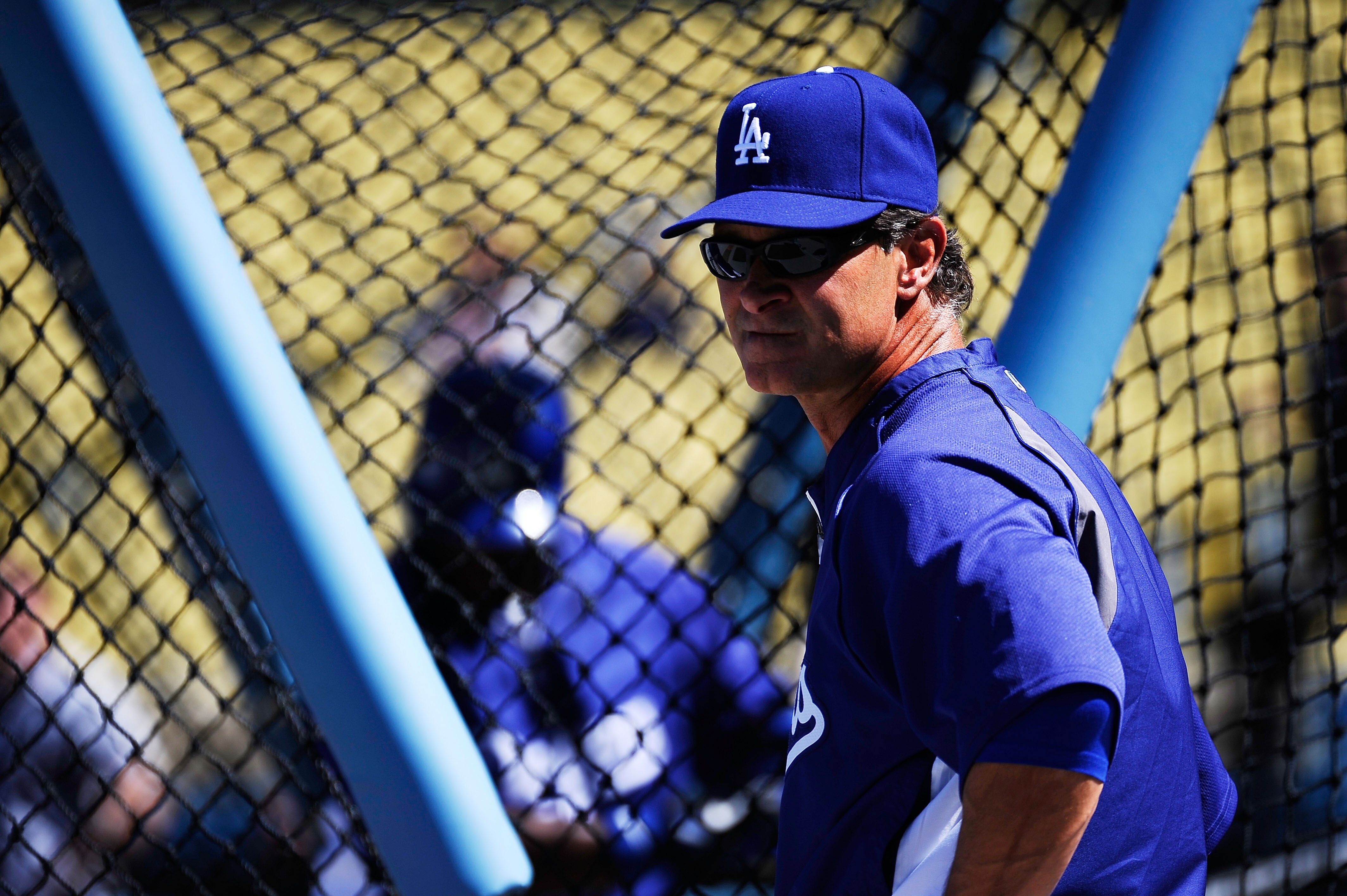 LOS ANGELES, CA - MARCH 31:  Manager Don Mattingly #8 of the Los Angeles Dodgers stands on the field during batting practice prior to their game against the San Francisco Giants on Opening Day at Dodger Stadium on March 31, 2011 in Los Angeles, California