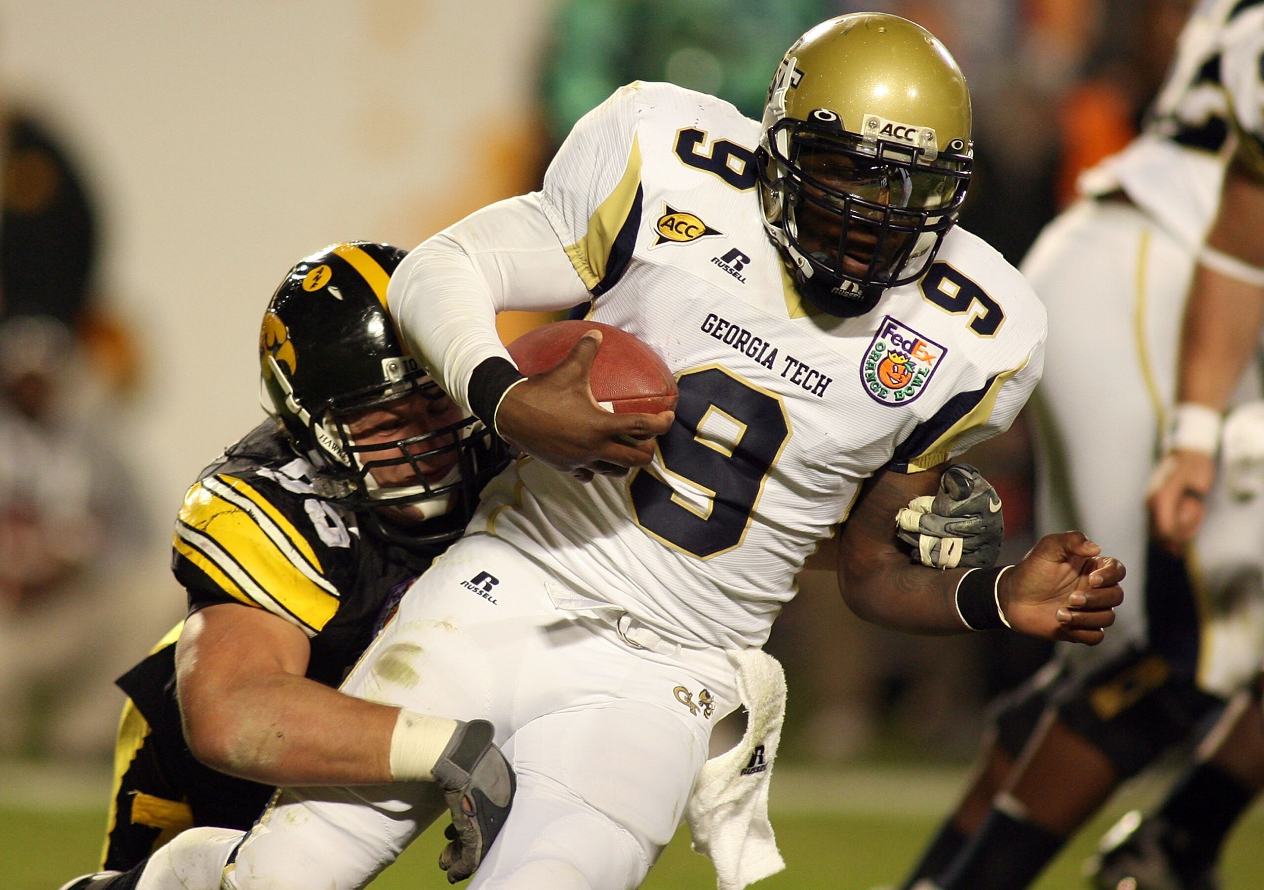 MIAMI GARDENS, FL - JANUARY 05: Josh Nesbitt #9 of the Georgia Tech Yellow Jackets is sacked by Karl Klug #95 of the Iowa Hawkeyes during the FedEx Orange Bowl at Land Shark Stadium on January 5, 2010 in Miami Gardens, Florida. (Photo by Marc Serota/Ge MIAMI GARDENS, FL - JANUARY 05: Josh Nesbitt #9 of the Georgia Tech Yellow Jackets is sacked by Karl Klug #95 of the Iowa Hawkeyes during the FedEx Orange Bowl at Land Shark Stadium on January 5, 2010 in Miami Gardens, Florida. (Photo by Marc Serota/Ge
