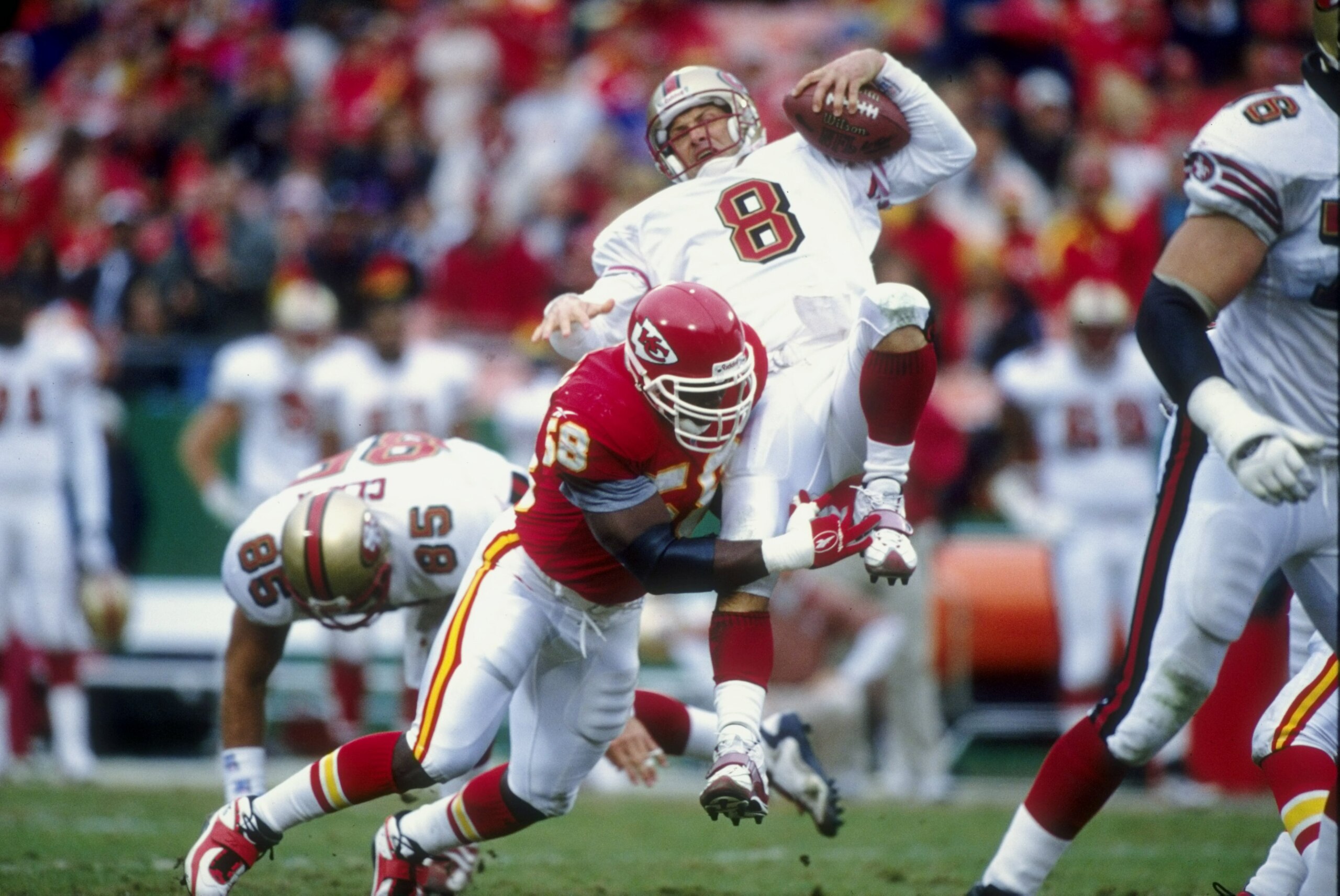 30 Nov 1997:  Derrick Thomas #58 of the Kansas City Chiefs tackling Quarterback Steve Young #8 during the game against the San Francisco 49ers at the Arrowhead Stadium in Kansas City, Missouri. The Chiefs defeated the 49ers 44-9. Mandatory Credit: Jonatha