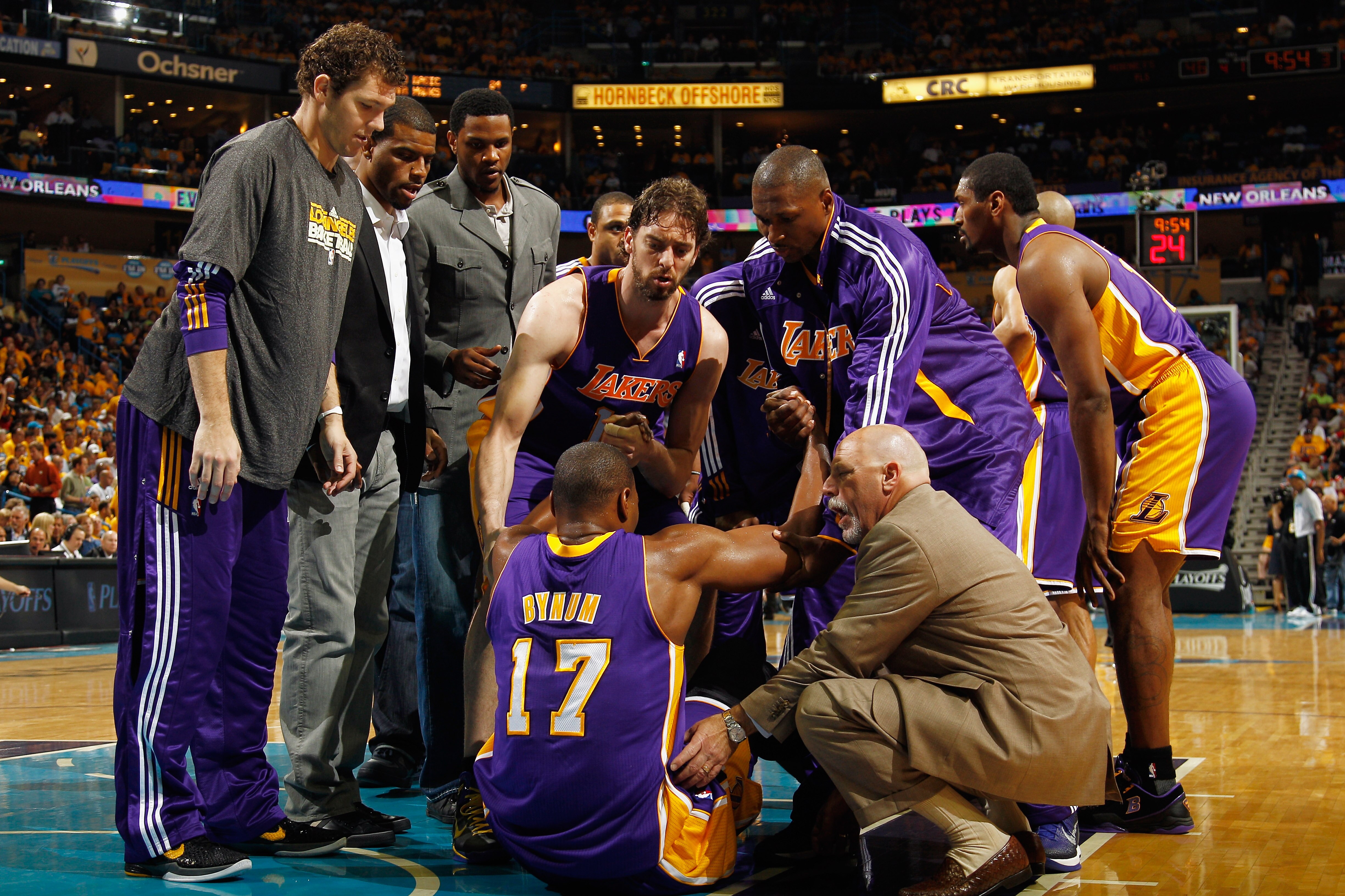 NEW ORLEANS, LA - APRIL 22:  Andrew Bynum #17  of the Los Angeles Lakers is helped up after being hurt during the game against the New Orleans Hornets in Game Three of the Western Conference Quarterfinals in the 2011 NBA Playoffs at the New Orleans Arena