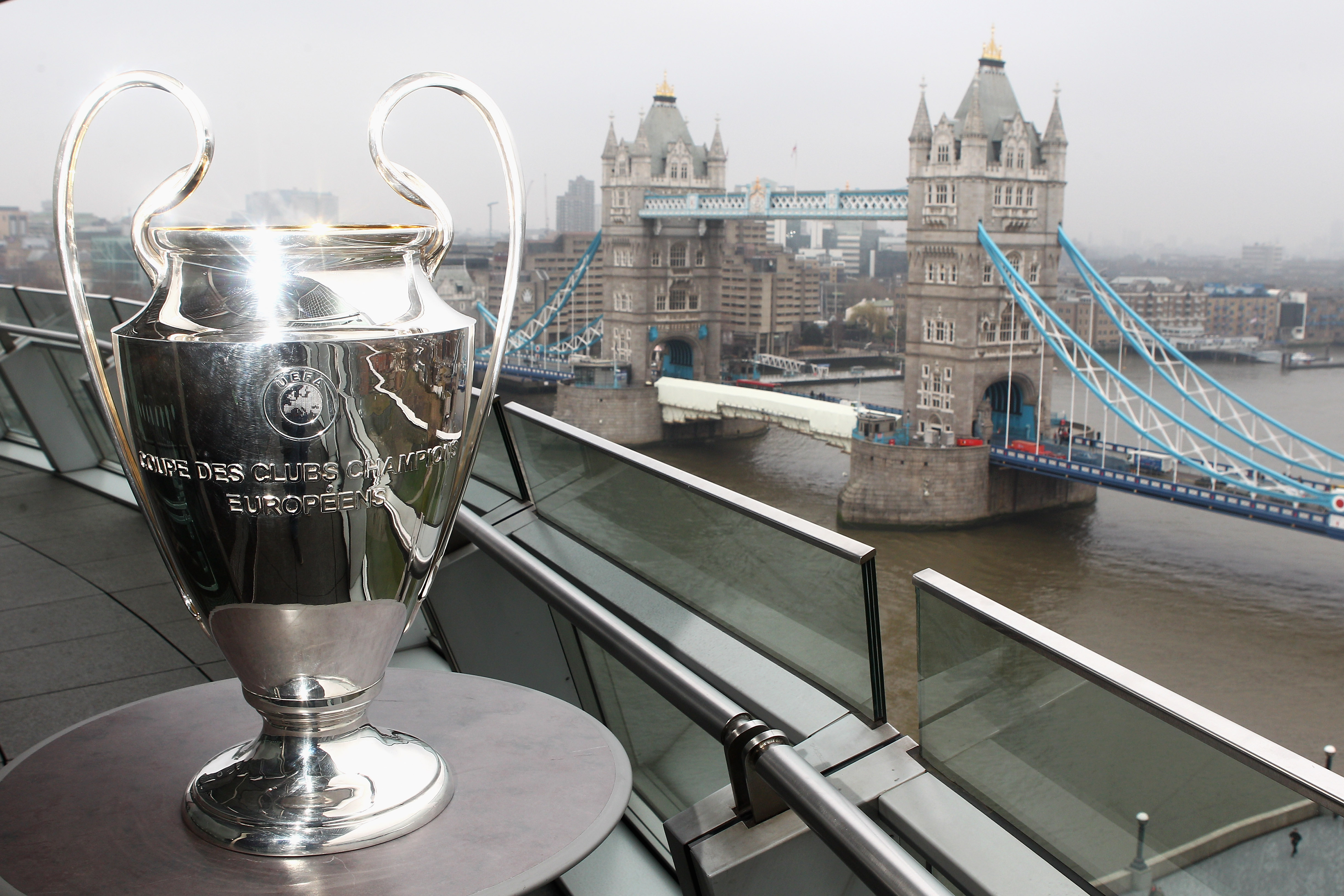 LONDON, ENGLAND - FEBRUARY 17:  The Trophy is pictured in front of Tower Bridge during the UEFA Champions League Final 2011 Ticket Launch at City Hall on February 17, 2011 in London, England.  (Photo by Dean Mouhtaropoulos/Getty Images)