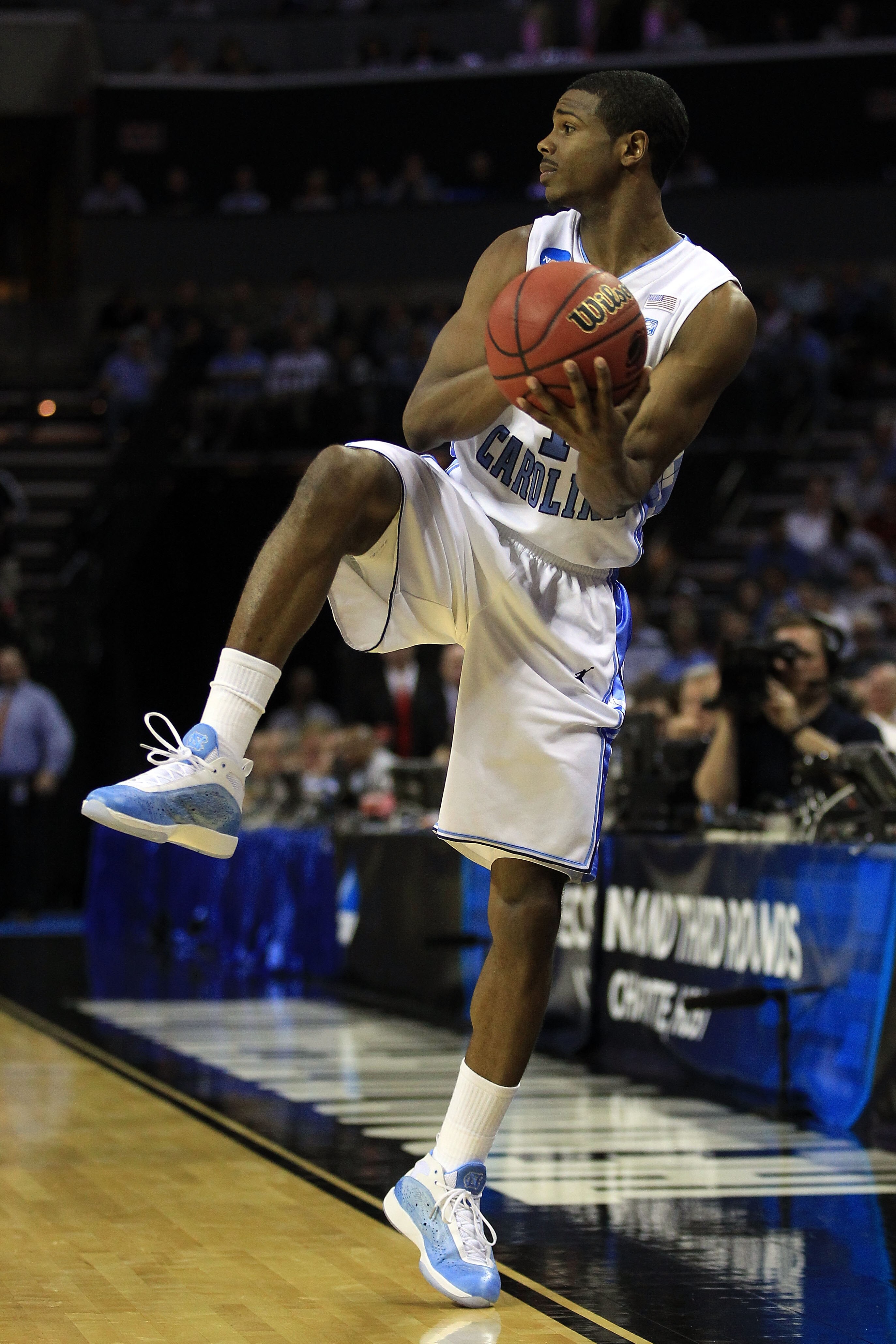 CHARLOTTE, NC - MARCH 18:  Dexter Strickland #1 of the North Carolina Tar Heels looks to save the ball in the first half while taking on the Long Island Blackbirds during the second round of the 2011 NCAA men's basketball tournament at Time Warner Cable A