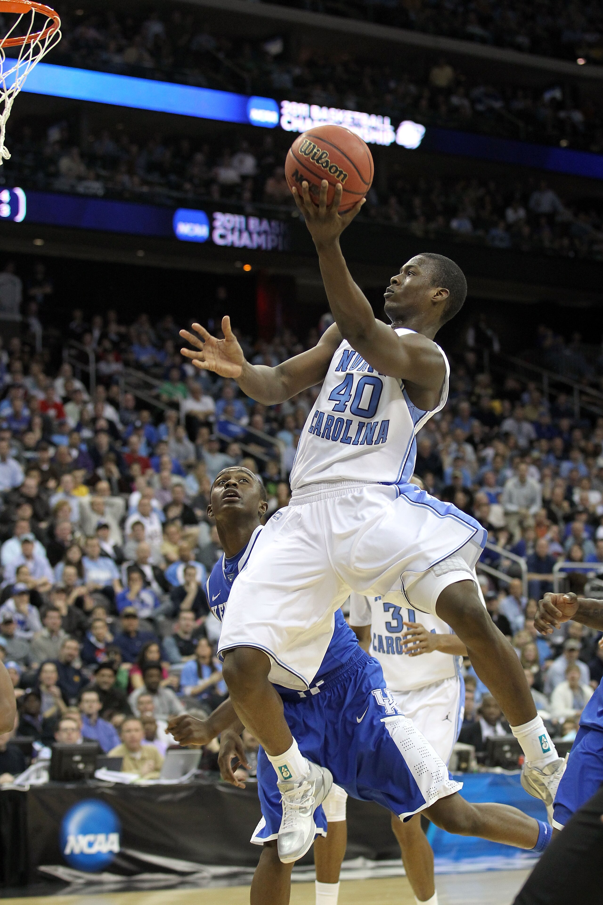 NEWARK, NJ - MARCH 27: Harrison Barnes #40 of the North Carolina Tar Heels goes for a layup against Doron Lamb #20 of the Kentucky Wildcats during the east regional final of the 2011 NCAA men's basketball tournament at Prudential Center on March 27, 2011 NEWARK, NJ - MARCH 27: Harrison Barnes #40 of the North Carolina Tar Heels goes for a layup against Doron Lamb #20 of the Kentucky Wildcats during the east regional final of the 2011 NCAA men's basketball tournament at Prudential Center on March 27, 2011