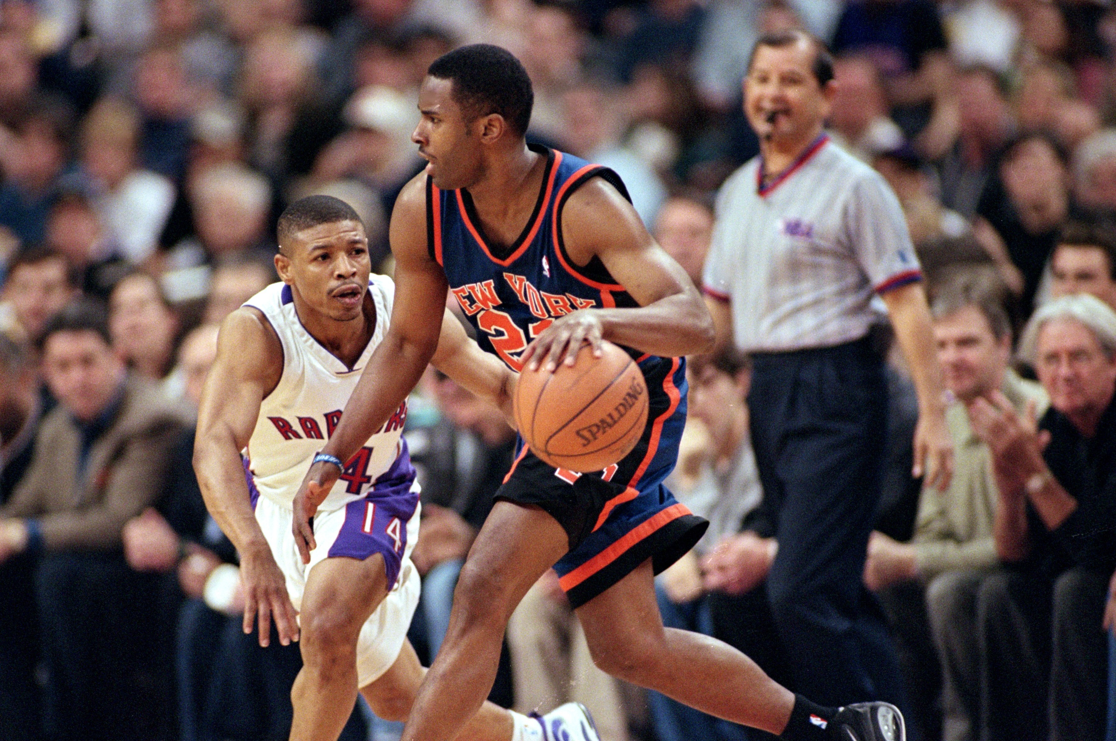 30 Apr 2000:  Charlie Ward #21 of the New York Knicks moves with the ball around Muggsy Bogues #14 of the Toronto Raptors during the NBA Eastern Conference Round One Game at the Air Canada Centre in Toronto, Ontario, Canada. The Knicks defeated the Raptor