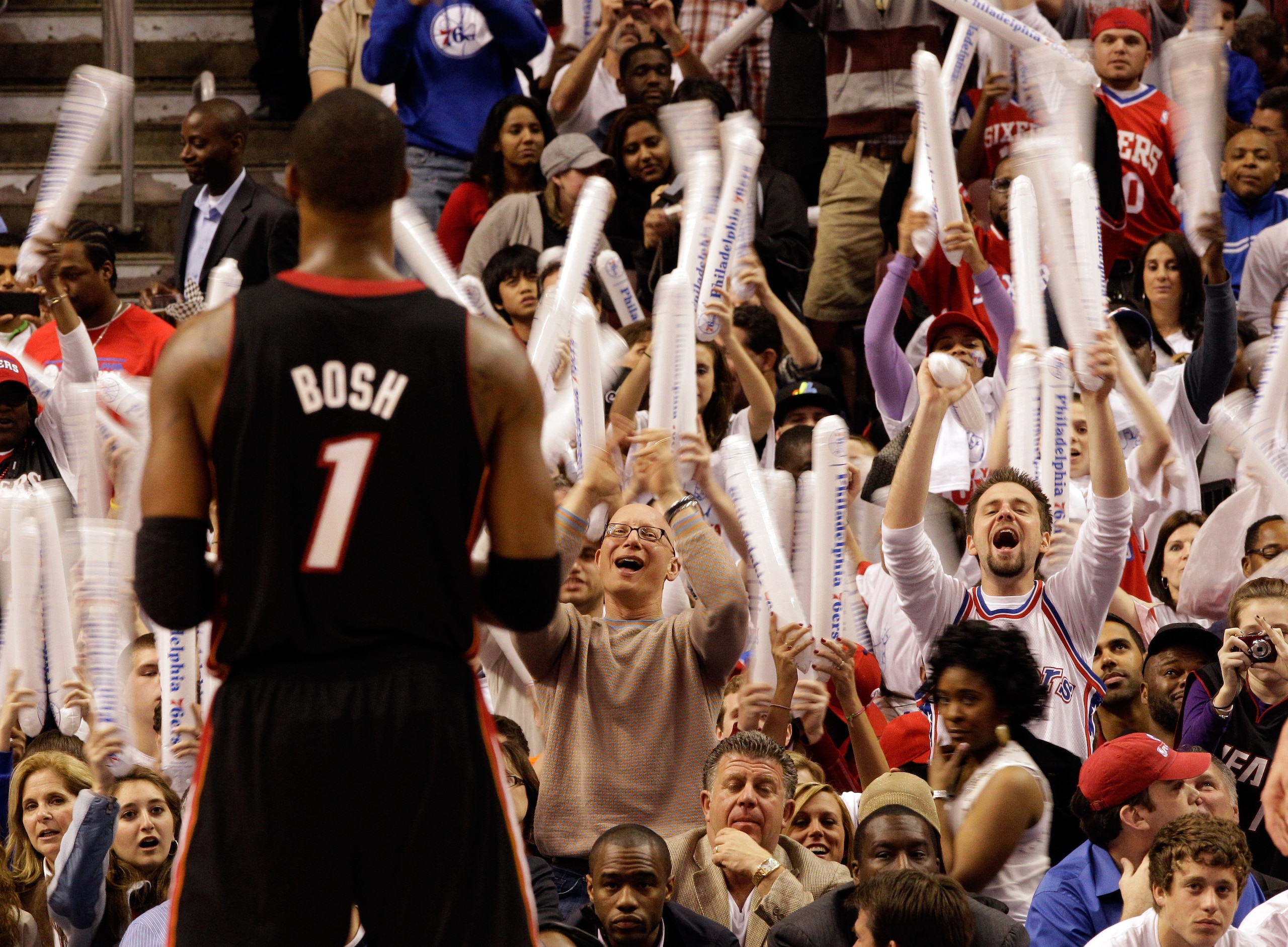 PHILADELPHIA, PA - APRIL 21: Chris Bosh #1 of the Miami Heat shoots a free throw as Philadelphia 76ersfans try and distract him during the second half of game three of the Eastern Conference Quarterfinals at Wells Fargo Center on April 21, 2011 in Philade