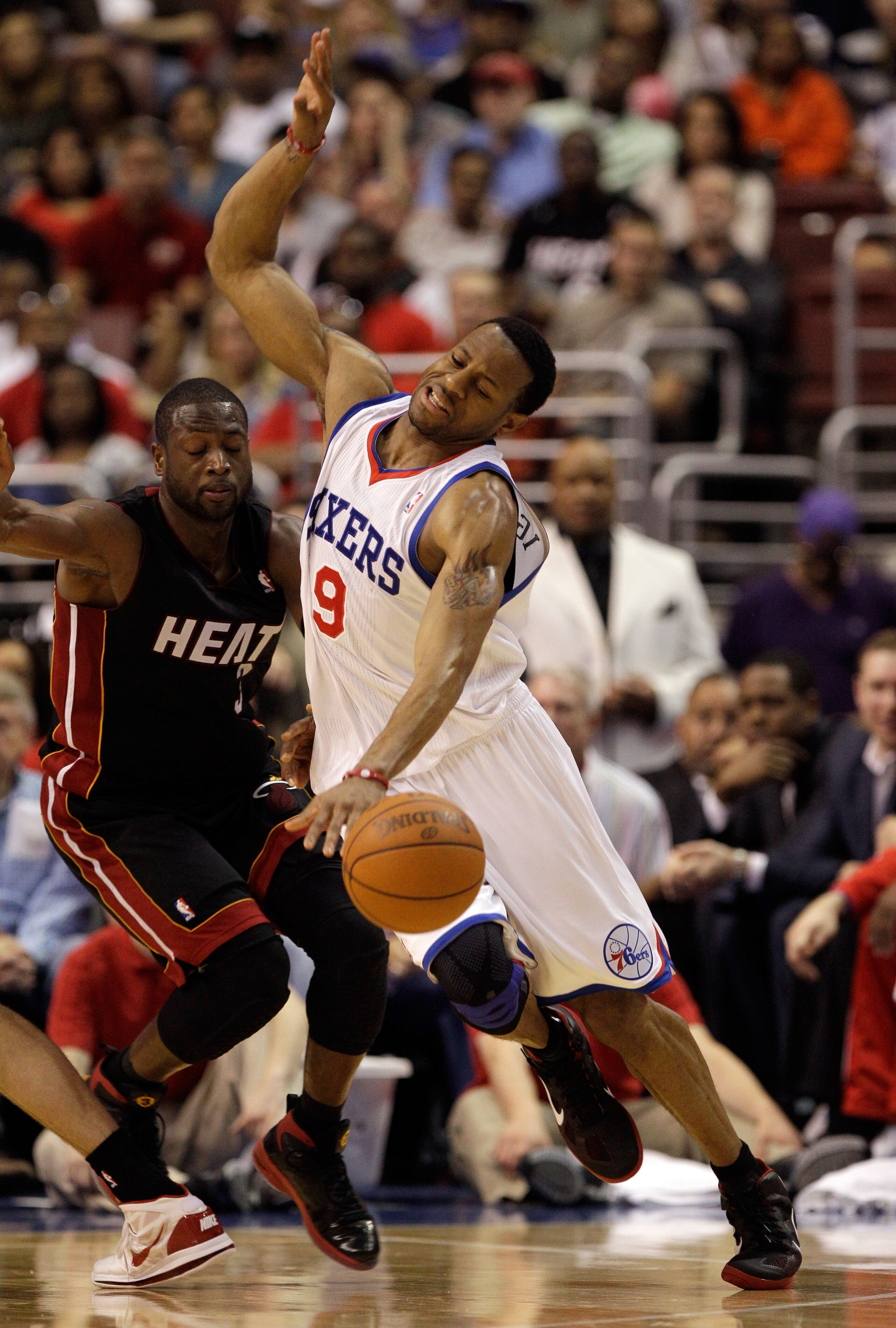 PHILADELPHIA, PA - APRIL 24: Dwyane Wade #3 of the Miami Heat fouls Andre Iguodala #9 of the Philadelphia 76ers in Game Four of the Eastern Conference Quarterfinals in the 2011 NBA Playoffs at Wells Fargo Center on April 24, 2011 in Philadelphia, Pennsylv