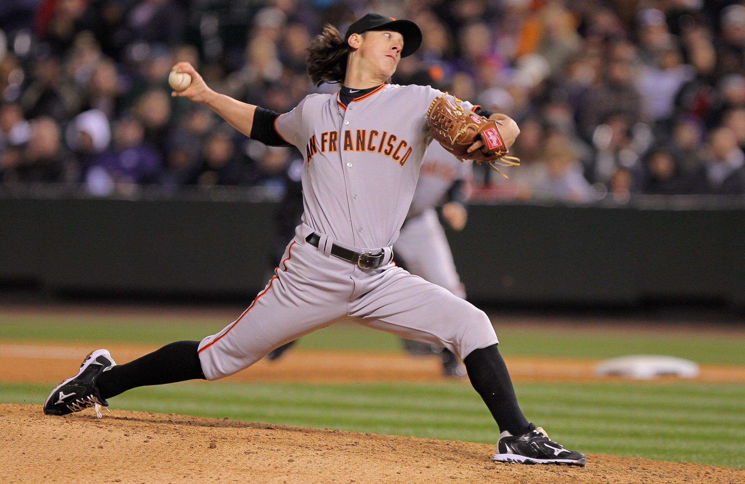 DENVER, CO - APRIL 18:  Starting pitcher Tim Lincecum #55 of the San Francisco Giants works against the Colorado Rockies at Coors Field on April 18, 2011 in Denver, Colorado. Lincecum recorded 10 strike outs as he earned the win as the Giants defeated the