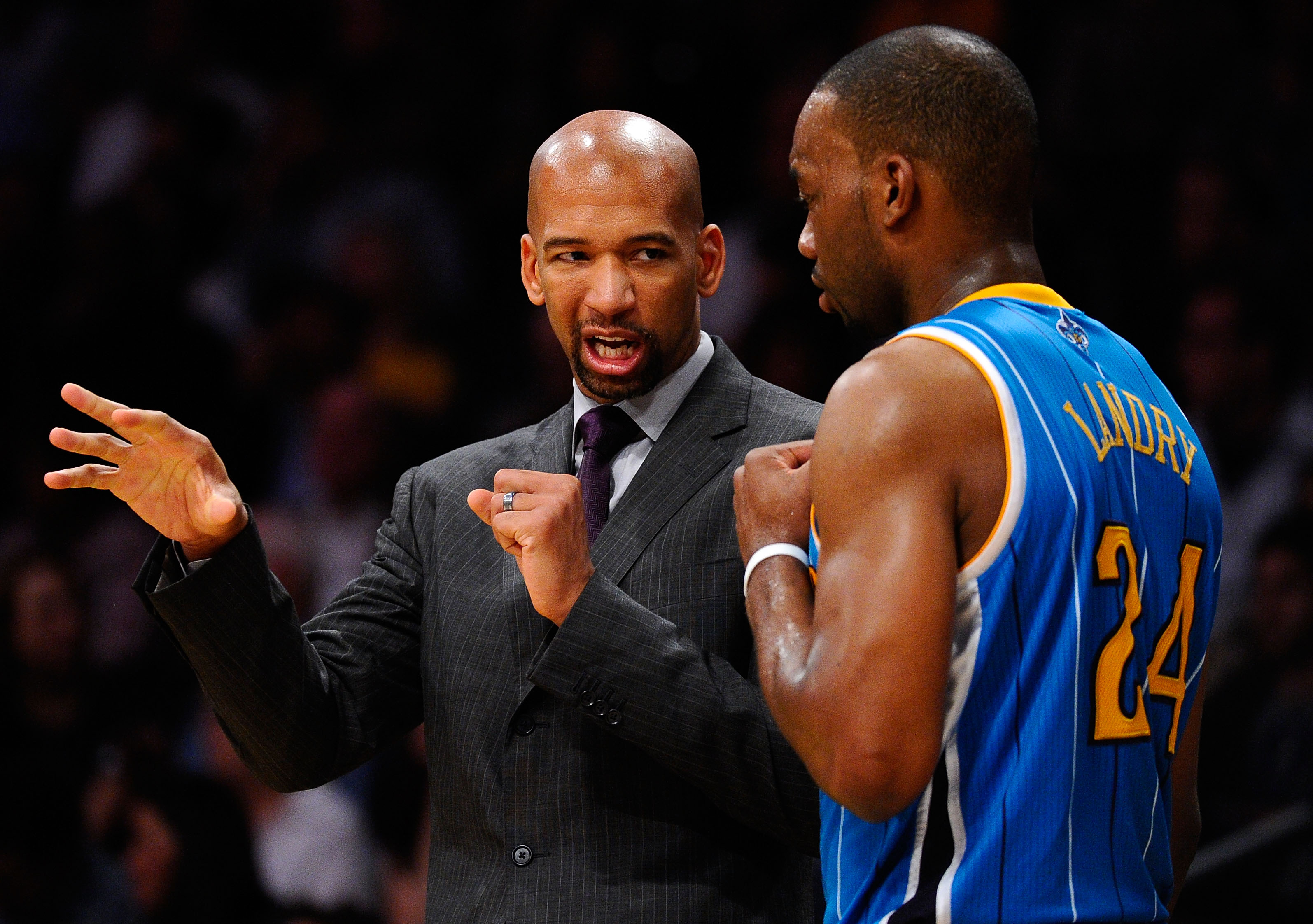 LOS ANGELES, CA - APRIL 20:  Head coach Monty Williams of the New Orleans Hornets talks with Carl Landry #24 while taking on the Los Angeles Lakers in Game Two of the Western Conference Quarterfinals in the 2011 NBA Playoffs on April 20, 2011 at Staples C